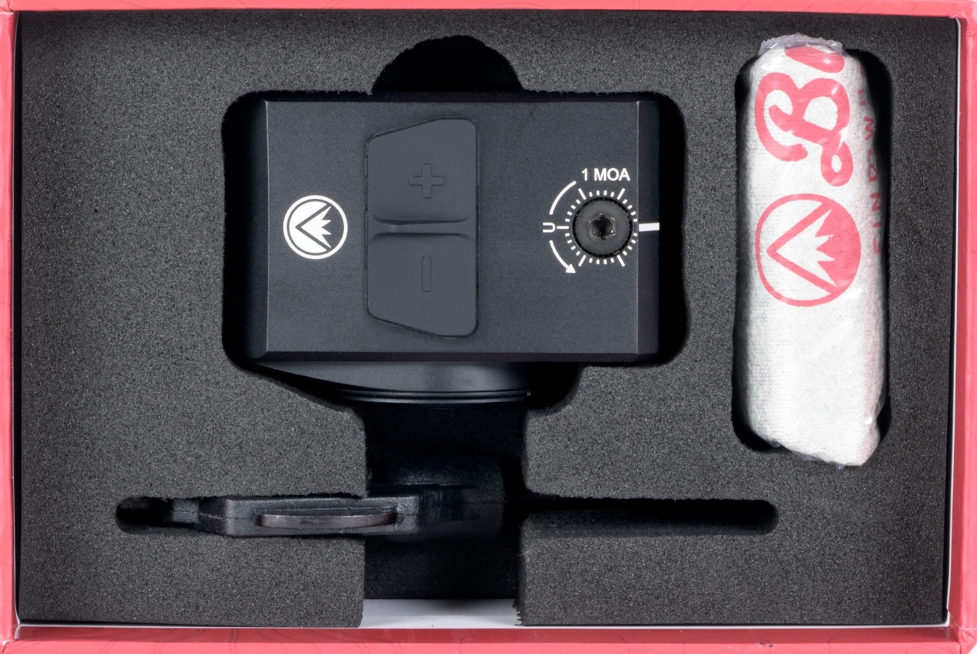 Photo displays the full contents of the Burris FastFire E box arranged on a flat surface. Items shown include the enclosed FastFire E red dot optic, a dedicated mounting plate (ACRO footprint), a T10 Torx multi-tool, a CR2032 battery, mounting screws, and a printed instruction manual. Each component is clearly separated and labeled for easy identification. The optic’s robust construction is visible, and the accessories are organized for a clear view of what buyers can expect. The user manual and warranty information are included in the layout. The background is neutral, focusing attention on the included items. This image is helpful for readers of a Burris FastFire E review wanting to know exactly what is provided in the retail package.