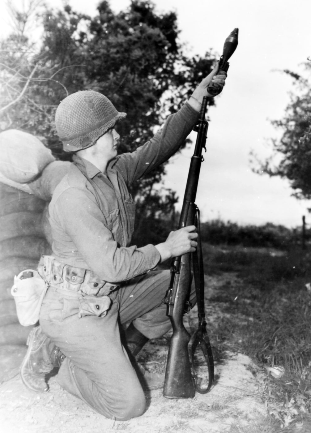of the 60mm mortar round on the M1 fragmentation grenade adapter. Note the adapter bodies to the right. With the 101st Airborne Division, Germany 1945. NARA