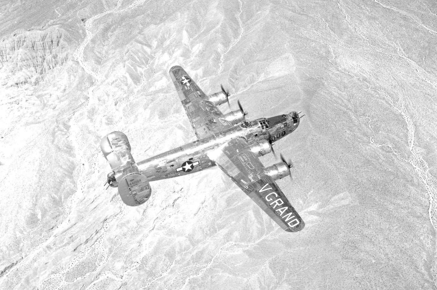 A Consolidated B-24J-195-CO Liberator, serial number 44-41064, nicknamed “V Grand,” is shown after completion at the San Diego plant. This aircraft was the 5000th B-24 produced at the facility, marking a major milestone in American wartime production. The fuselage features celebratory markings to commemorate the achievement. Despite its symbolic status, the bomber was delivered to the U.S. Army Air Forces and entered combat service with the Fifteenth Air Force in the Mediterranean. The B-24J variant was among the most numerous and featured standardized nose turrets and improved systems. “V Grand” represented both industrial might on the home front and operational contribution on the battlefield. The image reflects the scale of U.S. aircraft production during World War II.