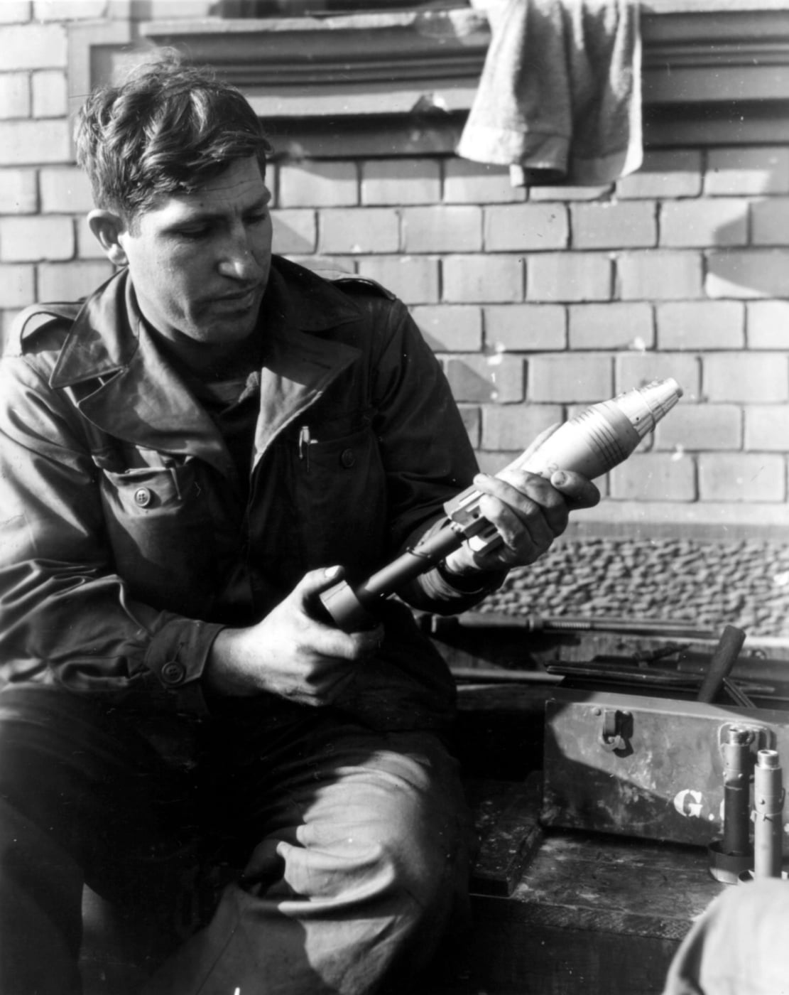 of the 60mm mortar round on the M1 fragmentation grenade adapter. Note the adapter bodies to the right. With the 101st Airborne Division, Germany 1945. NARA