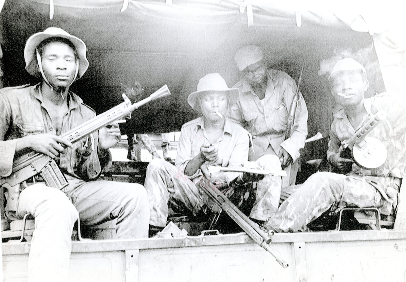 The photo shows Communist MPLA fighters in Angola during December 1975 holding CETME rifles. The CETME was a Spanish assault rifle directly developed from the German StG 45(M) and its roller-delayed blowback action. The fighters are standing in a field environment, dressed in simple uniforms and carrying their rifles casually. Each CETME features a long barrel, wooden furniture, and a detachable box magazine. The rifles were part of the wider Cold War supply of arms that reached Africa through Soviet and Cuban backing. This image highlights the legacy of German World War II small arms design as it reappeared decades later in a very different conflict. The MPLA would continue to use CETME and other European rifles throughout the Angolan Civil War.