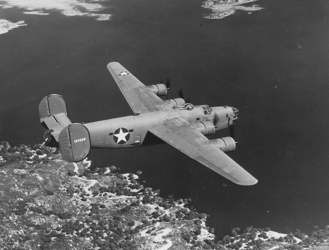 A U.S. Navy Consolidated PB4Y-1 Liberator heavy bomber in flight during World War II. The PB4Y-1 was a naval adaptation of the B-24 Liberator, modified for maritime patrol, anti-submarine warfare, and long-range reconnaissance. The aircraft retains the distinctive Davis wing and twin-tail design of the B-24. Its payload could include depth charges, bombs, or radar equipment for hunting enemy submarines. The Navy deployed the PB4Y-1 across both the Atlantic and Pacific, where it helped close the mid-ocean “air gap” against U-boats. This aircraft’s versatility allowed it to strike shipping lanes, scout enemy movements, and support fleet operations. The image highlights the close ties between Army and Navy aviation during the war.