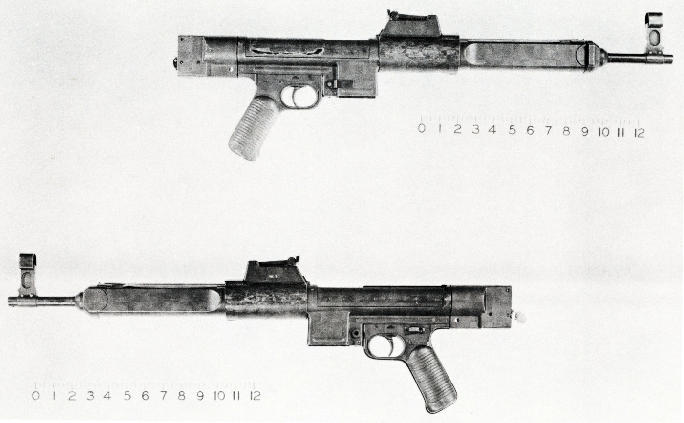 The photo shows the Mauser Gerät 06 prototype, an experimental German assault rifle developed in 1943. The rifle features a stamped steel receiver, plain wooden stock, and detachable magazine similar to the Sturmgewehr 44. Its most important feature was a roller-locked blowback action, borrowed from the MG 42 machine gun. This early system experienced problems with bolt bounce, but it became the foundation for the later roller-delayed design in the StG 45(M). Only a handful of Gerät 06 rifles were ever made for testing. The weapon represents a transitional step between the StG 44 and the final wartime prototypes. Its design directly influenced postwar developments in Spain and Germany.