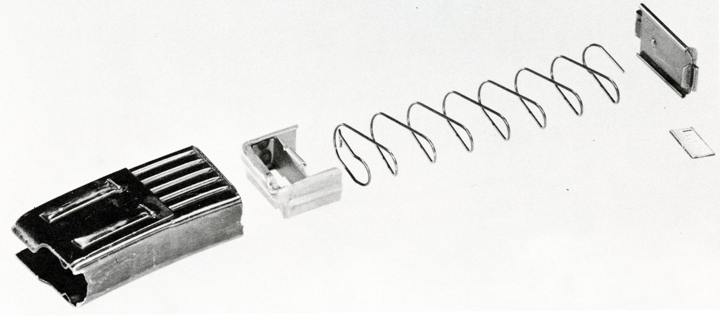 The photo shows a German StG 45(M) magazine produced in the final months of World War II. The magazine is made from stamped sheet metal, a cost-saving method used across many late-war German firearms. It was designed to hold the 7.92x33mm Kurz cartridge and fit both the 30-round and reduced 10-round configurations. Many surviving prototypes are pictured with the shortened 10-round version, which Mauser engineers preferred for test firing. The magazine design was simple but effective, with a detachable box layout and reinforced feed lips. Its construction reflects Germany’s urgent push to simplify weapons production during 1944–45. Very few original magazines survive today, making them rare collector’s items.