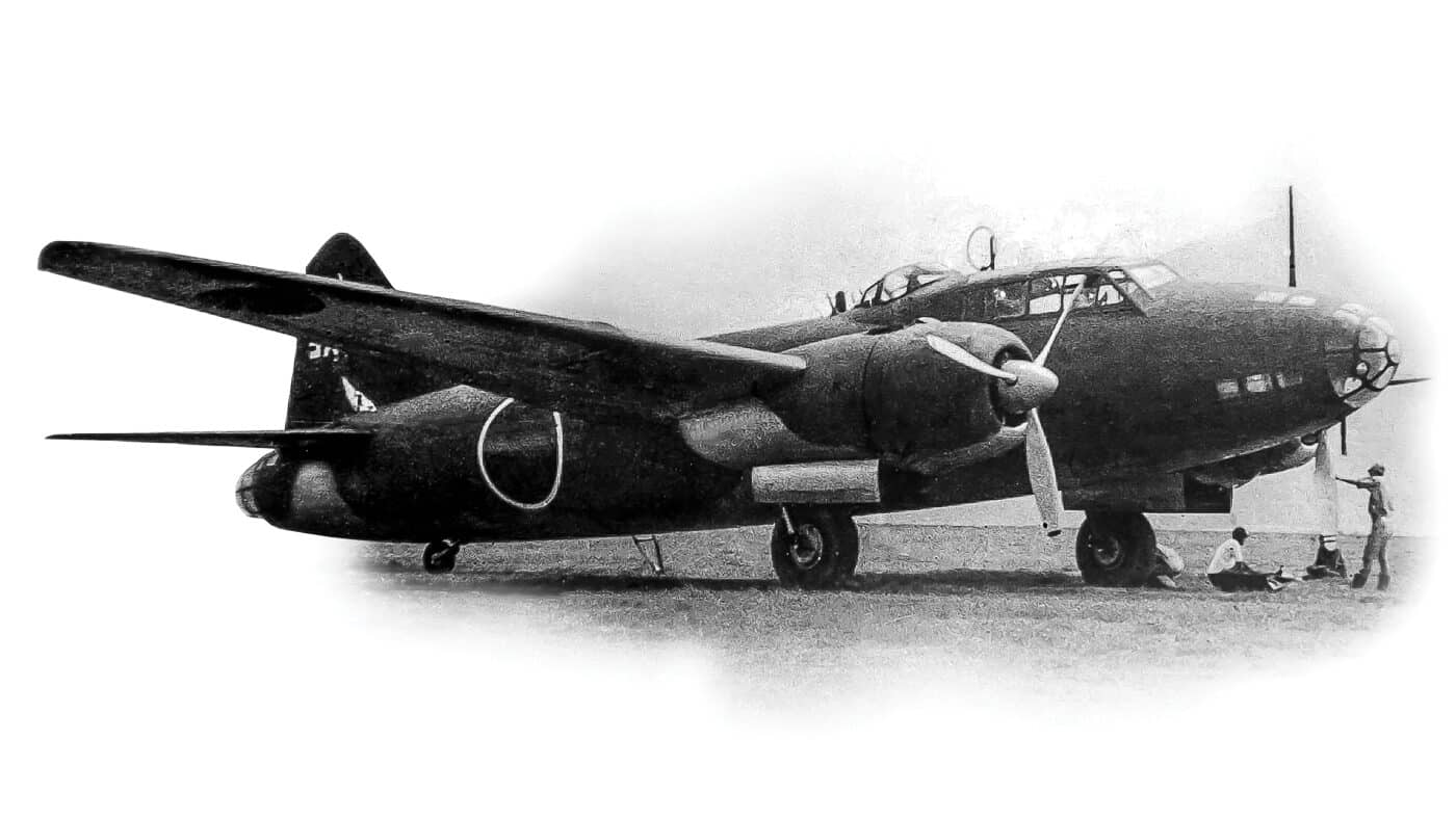 Archival image of the Japanese Mitsubishi G4M bomber, known by the Allied reporting name “Betty.” The aircraft is shown on the ground with its full wingspan and narrow fuselage clearly visible. Designed for long-distance missions, it was heavily used by the Imperial Japanese Navy Air Service throughout the Pacific War. Its light construction meant that it could fly farther than most bombers of its time, but at the cost of crew protection and survivability. Pilots and crews were vulnerable to Allied fighters, which frequently set these planes ablaze during combat. The G4M that carried Admiral Yamamoto was ambushed and destroyed during Operation Vengeance in 1943, cementing the aircraft’s role in history.