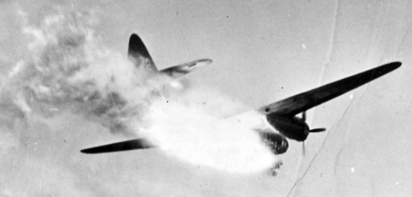 Black-and-white wartime photo of a Mitsubishi G4M bomber in flight, known by its Allied code name “Betty.” The aircraft has a long, narrow fuselage and twin engines, optimized for range but lacking protective armor. Its light structure and unprotected fuel tanks made it extremely vulnerable in combat, often bursting into flames when hit. Japanese crews nicknamed it “Hamaki,” meaning cigar, while Allied airmen referred to it as “the flying lighter.” Despite its flaws, the G4M was heavily used in the Pacific theater for bombing and transport roles. The aircraft’s reputation for catching fire overshadowed its otherwise impressive range and speed.