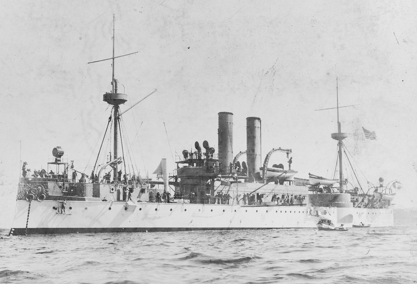 The photo shows USS Maine, a U.S. Navy pre-dreadnought battleship, underway at sea in the late 19th or early 20th century. The ship has a steel hull, multiple smaller-caliber gun turrets, and a distinctive military mast typical of pre-dreadnought design. Unlike later battleships, Maine carried a mixed armament of heavy and secondary guns rather than focusing on a single large caliber. She represented the transition from ironclad warships to modern steel battleships. Her design reflected naval thinking before HMS Dreadnought rendered such vessels obsolete in 1906. The photo captures an era of experimentation in shipbuilding, where speed, armor, and firepower were still being balanced. Maine’s silhouette demonstrates the technological limits and naval strategy of her time.