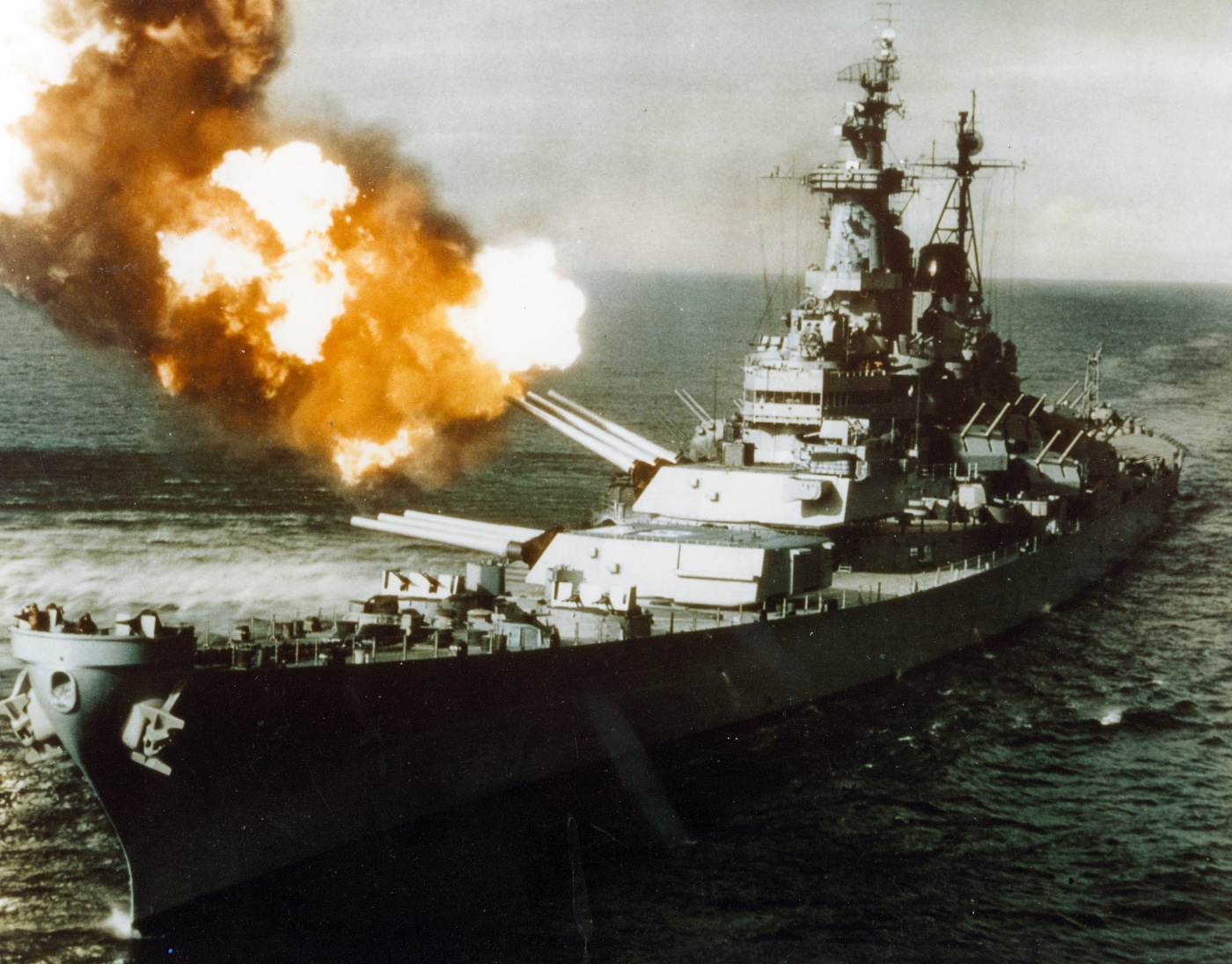 This photo highlights a battleship firing its enormous guns, producing a huge fireball and heavy smoke drifting across the deck. The blast conveys the raw force that made these ships feared during World War II and the Cold War. Battleships could hurl projectiles over long distances with destructive accuracy, supporting land operations or threatening enemy fleets. But the question remains: why are battleships obsolete in today’s military environment? The answer lies in advances such as carrier aviation, cruise missiles, and submarine warfare, all of which proved more flexible and deadly. The battleship’s dramatic gunnery looks impressive, but it represents an outdated method of projecting naval power. The photo emphasizes the gap between the spectacle of old technology and the realities of modern combat.