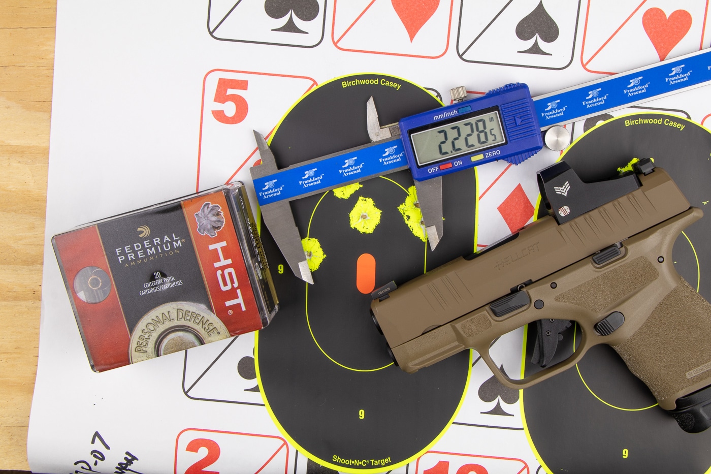 Shooting targets and ammunition at gun club range showing membership benefits of testing space and load development opportunities. Gun clubs provide members with range facilities for ammunition testing accuracy evaluation and handload development without crowded conditions. Joining shooting clubs offers firearm owners dedicated time for testing factory ammunition handloads and evaluating pistol or rifle performance. Firearms club membership includes access to ranges with target systems for ammunition accuracy testing and load workup sessions. Shooting range club members benefit from adequate practice time to test different ammunition types evaluate handgun or rifle accuracy and develop optimal loads using club equipment like chronographs and shooting benches.