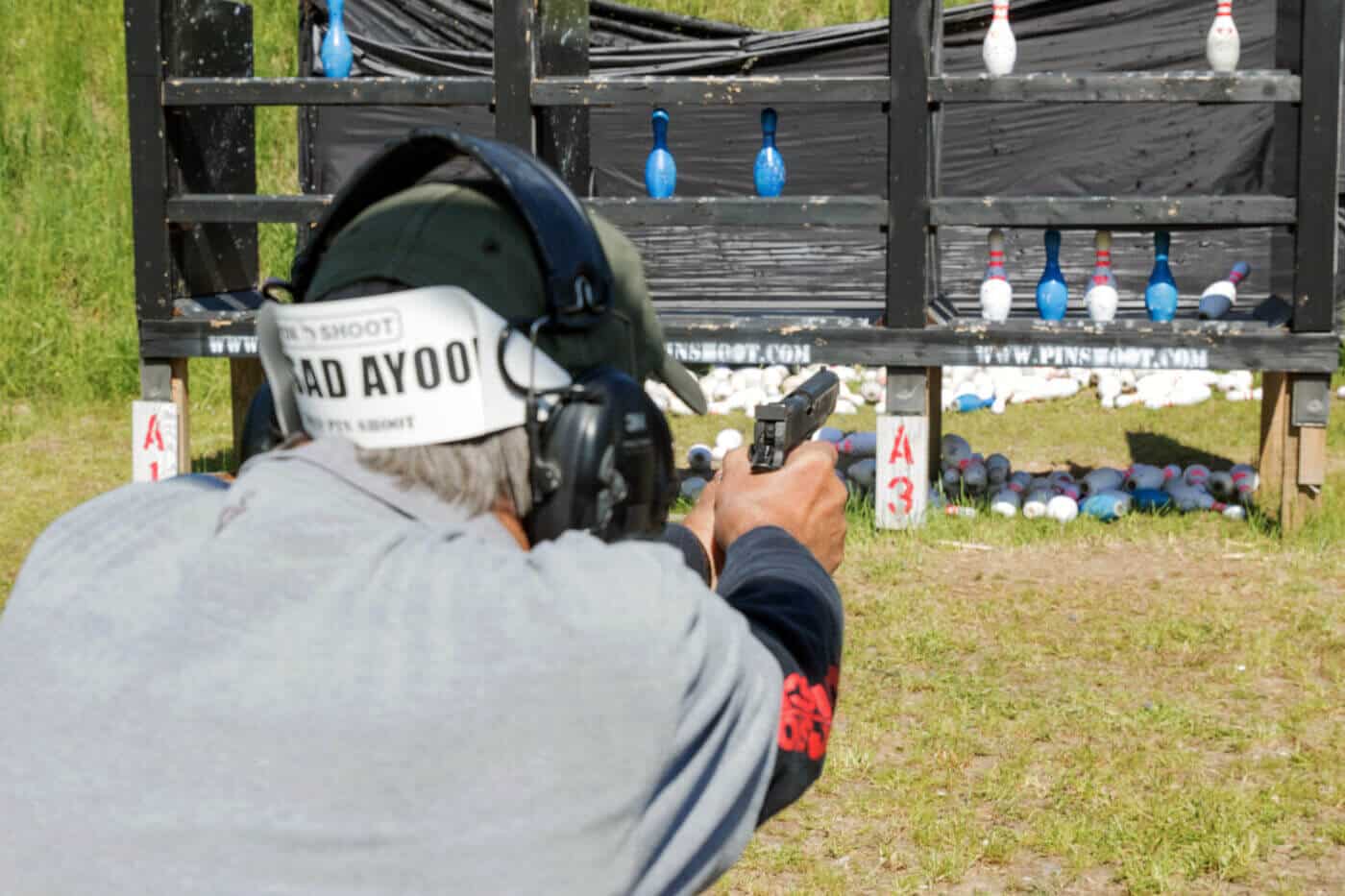 Gun club competition participant demonstrating advantages of shooting club membership including match access training opportunities and connections with skilled marksmen. Firearms clubs provide members with competitive shooting events range facilities and instruction from experienced shooters. Reasons to join gun clubs include participation in pistol and rifle competitions access to practice ranges and community of shooting enthusiasts. Shooting range club membership offers benefits like competitive match opportunities skill development programs and training from nationally recognized instructors. Club members improve marksmanship through regular practice competitive events and learning from experienced firearm handlers at member facilities.