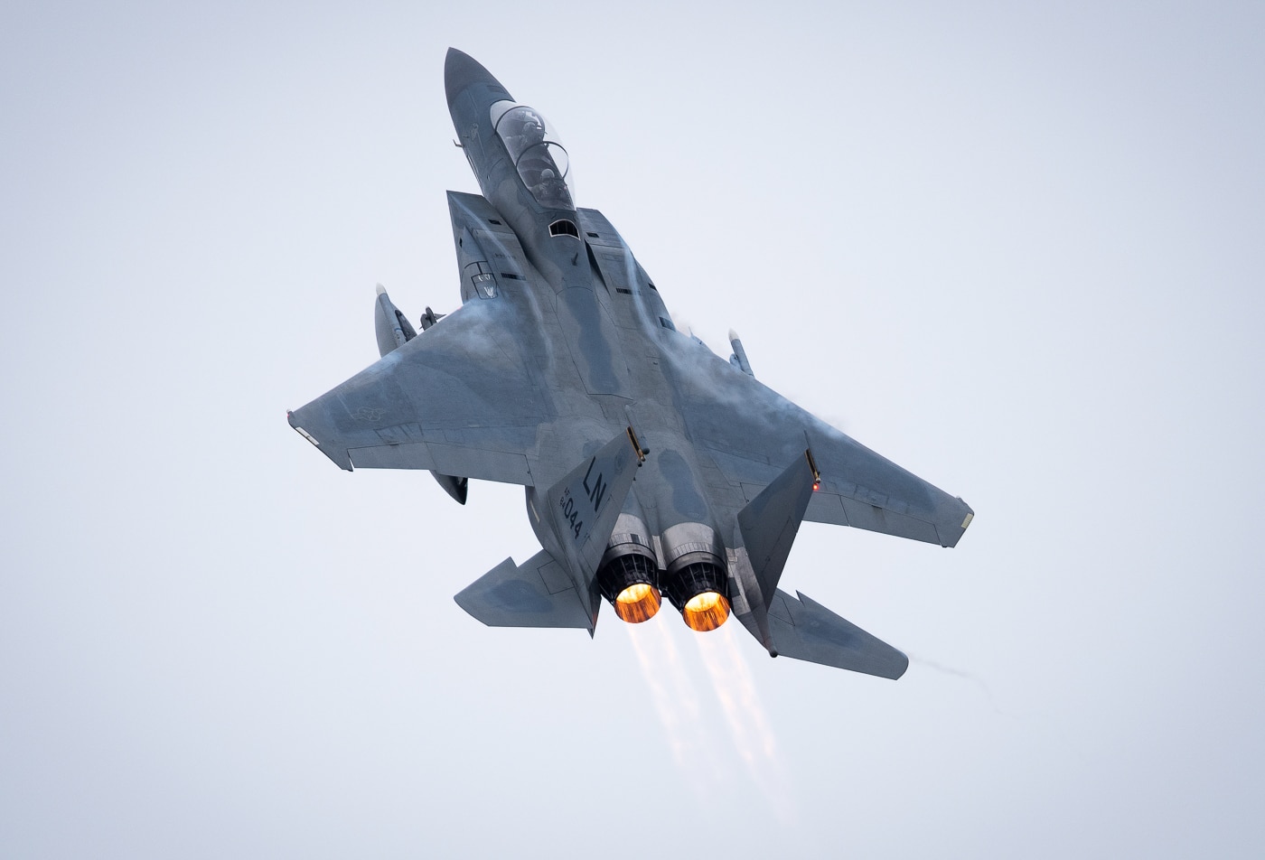 A U.S. Air Force F-15D Eagle assigned to the 493rd Fighter Squadron is photographed taking off from Royal Air Force Lakenheath, England, on February 28, 2020. The two-seat fighter, part of the 48th Fighter Wing’s “Liberty Wing,” powers down the runway with its landing gear still extended. Visible heat shimmer trails from the twin engines as the jet climbs into overcast skies. The F-15D provides both air-to-air superiority and precision air-to-ground capability, making it one of the Air Force’s most versatile platforms. RAF Lakenheath serves as a forward-deployed hub for U.S. air operations in Europe. This photo highlights the power, reliability, and readiness of American tactical aviation. It reflects the continuous training that ensures air dominance in any weather or combat scenario.