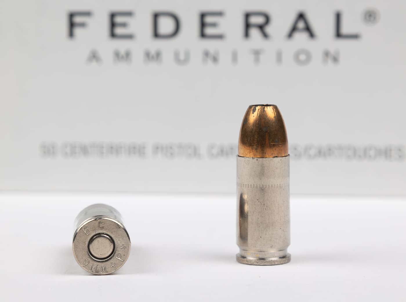 Photograph displaying Federal 9BPLE ammunition featuring 115 grain jacketed hollow point bullets loaded to plus P plus overpressure specifications used by Illinois State Police. The legendary law enforcement load exceeds standard plus P pressure levels without official SAAMI specifications. Plus P plus ammunition represents overpressure loading beyond even higher pressure plus P standards. Federal produced this famous 9mm overpressure load for law enforcement duty use despite non-standardized pressure levels. The Illinois State Police load became renowned among shooters for terminal performance at extreme pressure levels. Law enforcement agencies fired this overpressure ammunition in duty firearms for years causing accelerated wear. Plus P plus loads lack official pressure specifications making safety determinations difficult for shooters. This Federal 115 grain hollow point ammunition demonstrates overpressure loading beyond standard SAAMI plus P limits.