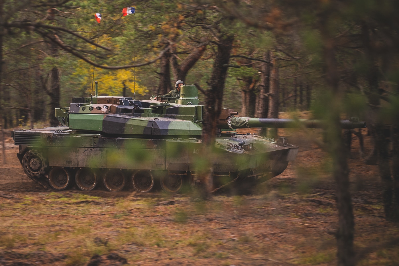 A French Leclerc main battle tank is pictured in Latvia during NATO’s Iron Spear exercise. The tank is part of France’s deployed forces under NATO’s forward presence mission. Its long smoothbore gun, low-profile turret, and modular armor are visible in the photograph. Iron Spear brings together tanks from multiple NATO members to test precision gunnery and maneuvering. The event strengthens allied cooperation and demonstrates collective deterrence. The photo captures the Leclerc in an active role on the alliance’s eastern flank.