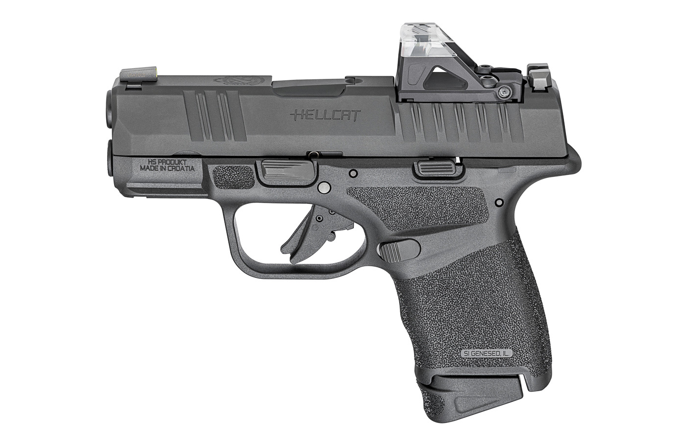 A Springfield Hellcat 380 ACP pistol is photographed in profile with a Shield Sights OMSsc optic mounted in the slide’s OSP cut. The image clearly shows the short 3-inch slide, the adaptive grip texture, and the small panoramic roof red-dot sight. The OMSsc’s translucent roof and low profile are visible, illustrating how it preserves the pistol’s slim carry dimensions. Iron sights are shown co-witnessing through the optic window, indicating backup capability if the dot fails. The photo highlights the Hellcat OSP’s optics-ready design and how it pairs with miniature reflex sights for faster target acquisition. Lighting and focus emphasize the optic interface and the handgun’s control-oriented ergonomics. This picture is suitable for a review section on optics choices and carry-ready configurations for the Springfield Hellcat 380 ACP.