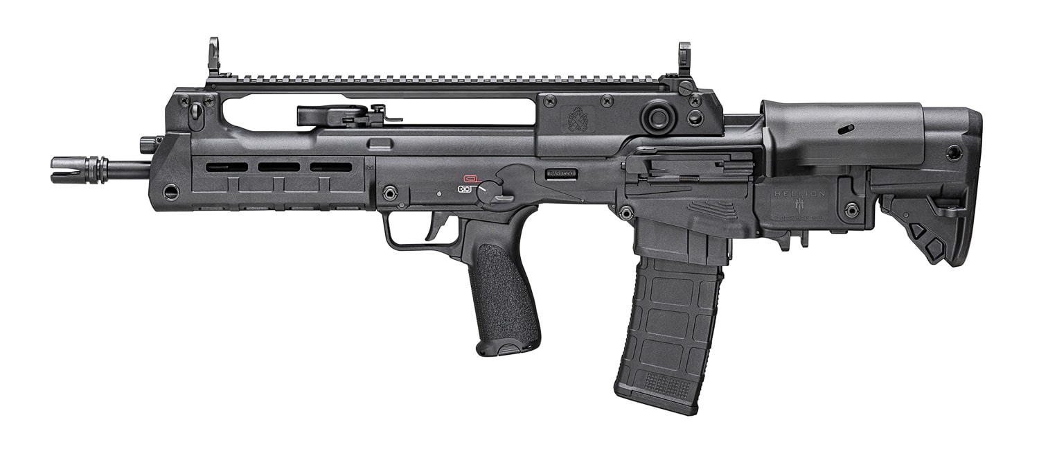 A detailed photo of the Springfield Armory Hellion rifle featured in Brownells’ Law Enforcement Patrol Rifle Program Discount. The rifle is displayed on a clean surface, highlighting its bullpup configuration with the magazine positioned behind the trigger. Key features such as the ambidextrous controls, full-length Picatinny rail, and compact barrel are clearly visible. The firearm’s sleek 5.56mm design represents modern patrol rifle standards for law enforcement use. The image emphasizes quality craftsmanship, practicality, and compact performance ideal for confined or urban environments. Background may include subtle branding or accessories like magazines and optics. Law enforcement patrol deals are similar to the Brownells veteran discount but intended for police patrol rifle and other LEO gear.
