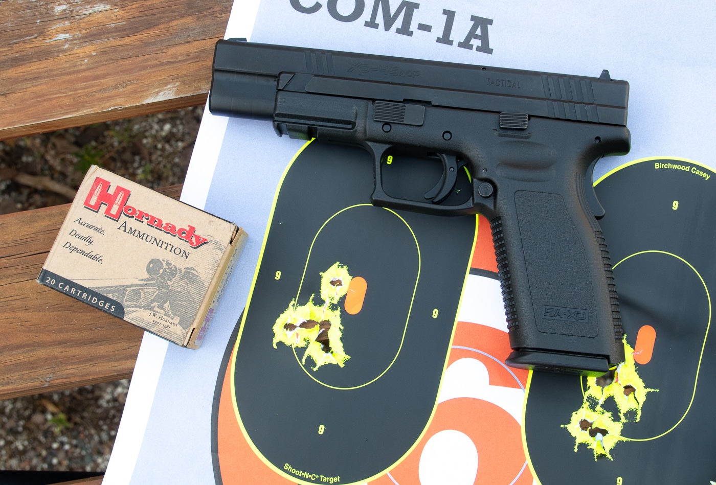 Photograph showing Springfield XD pistol in 45 ACP with Hornady plus P defensive ammunition and paper targets demonstrating rapid fire accuracy results at fifteen yards distance. Modern firearms from major manufacturers safely handle higher pressure ammunition when rated for overpressure loads. Training with plus P defensive ammunition helps shooters understand recoil characteristics and point of impact with overpressure loads. Springfield pistols are built to fire SAAMI specification plus P ammunition in appropriate calibers. Range testing with actual carry loads reveals how higher pressure ammunition performs in specific firearms. The targets show accuracy results achieved during rapid fire shooting with overpressure defensive loads. Shooters benefit from training with their carry ammunition to understand how plus P loads affect firearm performance. Modern handguns from reputable manufacturers handle higher pressure specifications as designed by engineers.