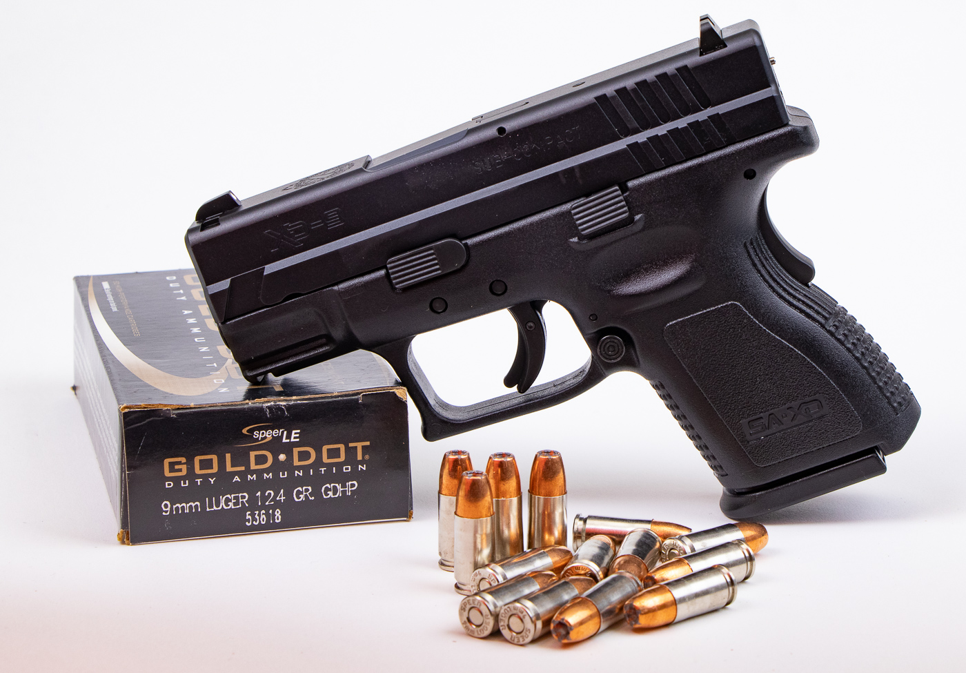 Springfield XD9 SubCompact pistol with Speer Gold Dot 124 grain hollow point ammunition demonstrating bullet weight considerations for concealed carry handguns. Compact defensive pistols with shorter barrels generate reduced velocities compared to full-size guns, affecting hollow point expansion at various bullet weights. Speer Gold Dot represents premium bonded defensive ammunition that maintains reliable performance across different barrel lengths and grain weights. The 124-grain bullet weight offers balanced terminal ballistics for compact carry guns, providing adequate penetration depth without excessive recoil. Selecting appropriate bullet weight for subcompact handguns requires understanding how reduced velocity affects hollow point expansion and penetration characteristics. Speer manufactures Gold Dot Short Barrel loads specifically engineered to expand reliably at lower velocities generated by compact defensive pistols. Bonded bullet construction prevents jacket separation and maintains weight retention through barriers better than conventional jacketed hollow points. The XD9 SubCompact demonstrates a typical concealed carry platform where bullet weight selection directly impacts defensive ammunition effectiveness and shooter control.