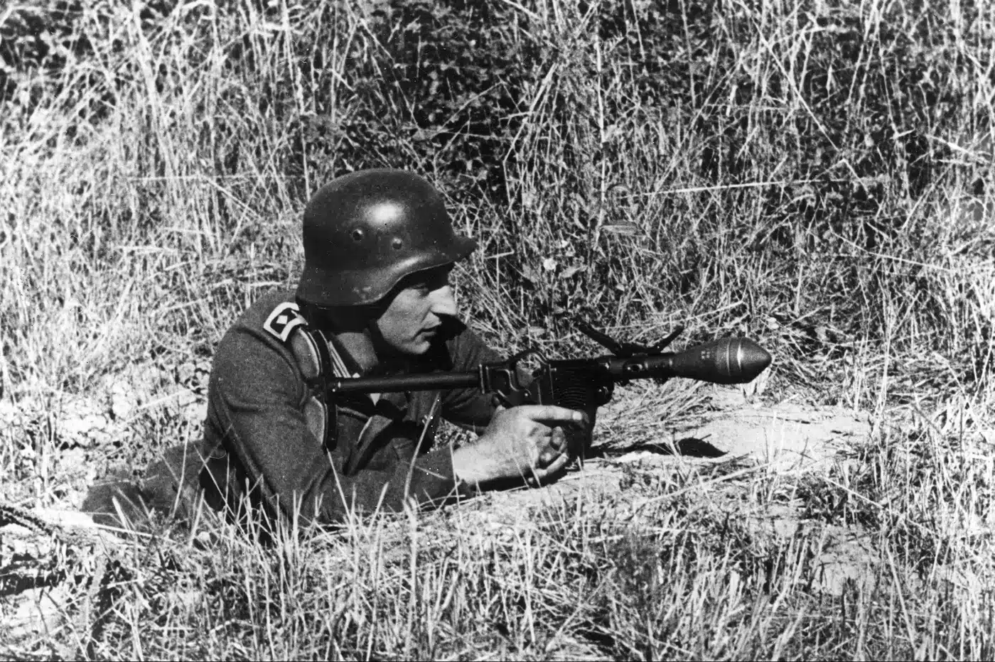 A German Panzerwurfkörper 42 hollow-charge grenade is shown, a small anti-tank weapon developed during World War II. It was designed to be fired from a modified flare pistol called the Sturmpistole. The warhead could theoretically penetrate up to 80 millimeters of armor, but its practical use against Allied tanks was limited. Soldiers had to approach dangerously close to enemy armor to fire the round. Because of this, it saw only limited service late in the war. The photo highlights the compact size and unusual appearance of this improvised anti-tank solution.