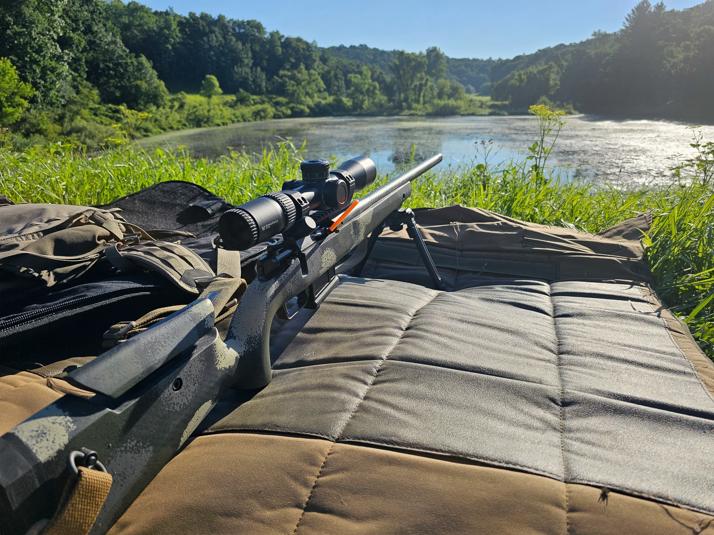 Participants in the Vortex Optics Hunter Marksmanship Course engage targets at varying distances while instructors observe. The program combines modern equipment with timeless shooting fundamentals, teaching rifle setup, zeroing, DOPE card creation, and field shooting techniques. This photo illustrates the outdoor portion of the course where wind, terrain, and position all play a role. It conveys the practical, real-world focus of Vortex Edge training. The overall atmosphere is serious but collaborative, centered on improving confidence and skill in hunting marksmanship.