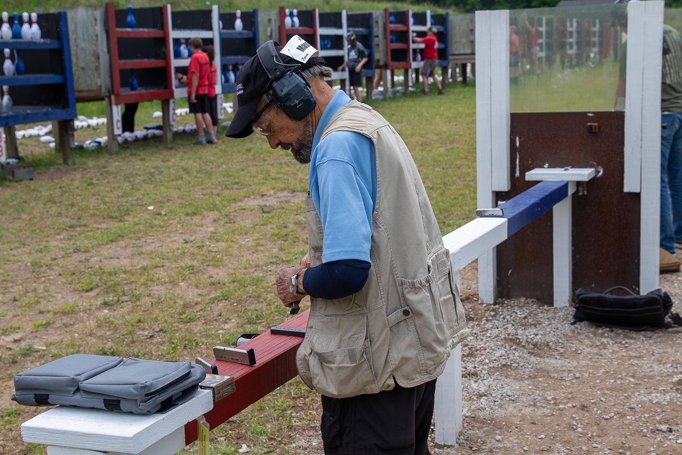 author loads his 1911 magazines between relays