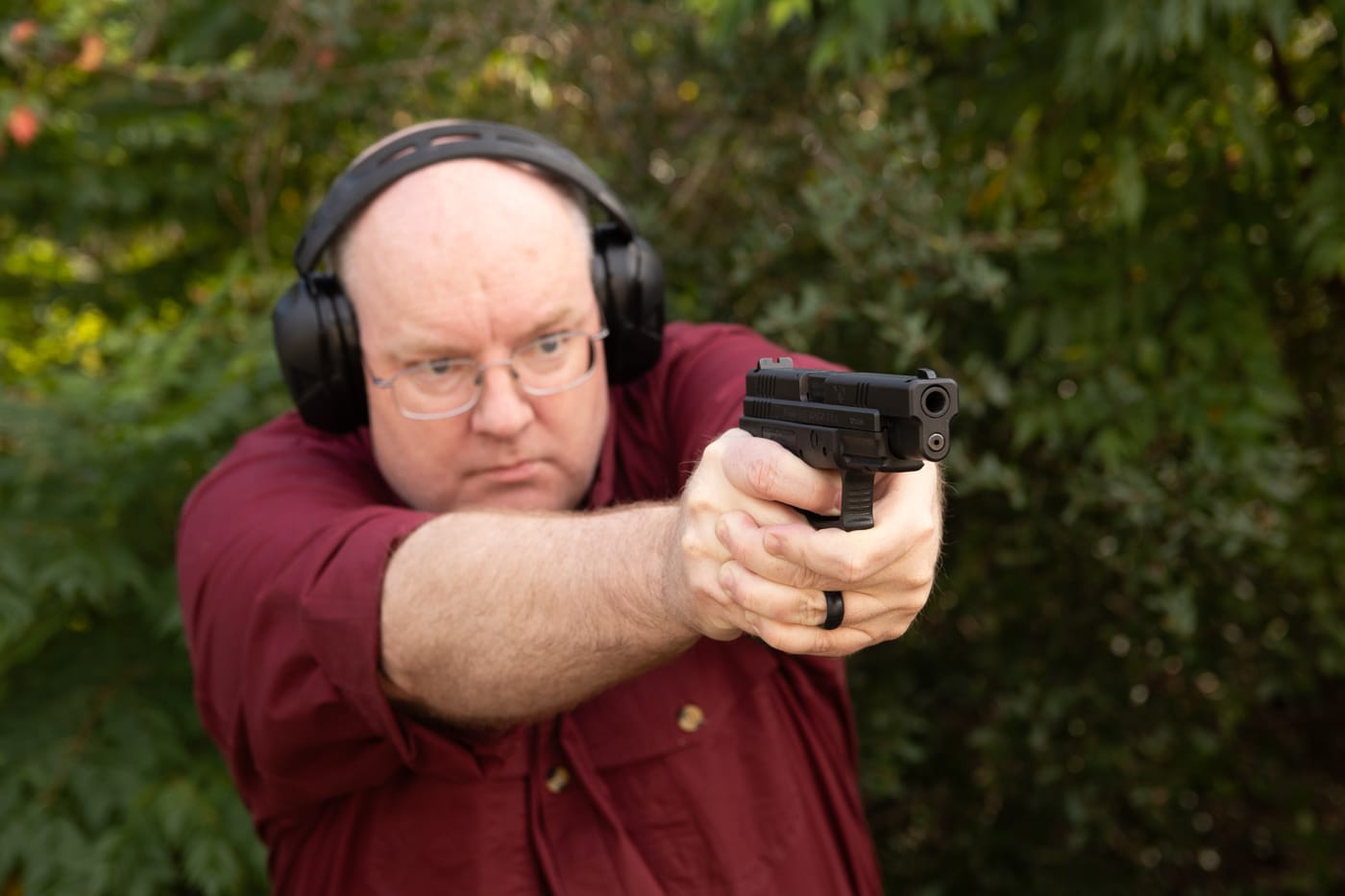 author shooting Springfield Armory XD pistol during testing on the range