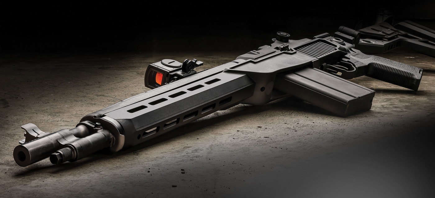 Springfield Armory M1A SOCOM rifle equipped with Delta 14 Chassis Gen 2 system displaying the complete modernized configuration of the classic battle rifle platform. The lightweight glass-filled nylon chassis weighs only 0.75 pounds dramatically reducing overall rifle weight while maintaining structural integrity for accurate shooting. M-Lok accessory slots along forend provide tactical mounting options for lights, lasers, and vertical grips. Flared magwell design facilitates rapid magazine changes with 20-round detachable box magazines during tactical or competitive shooting. Steel front ferrule and rear T-nut mount ensure durability at critical stress points despite lightweight polymer construction. Mossberg 500 pattern rear mount accepts various buttstock options from pistol grips to folding assemblies. The rifle maintains proven 7.62 NATO chambering and gas-operated rotating bolt action while gaining modern ergonomics and reduced weight. DuPont Zytel composite material provides automotive-grade durability and heat resistance during sustained fire.