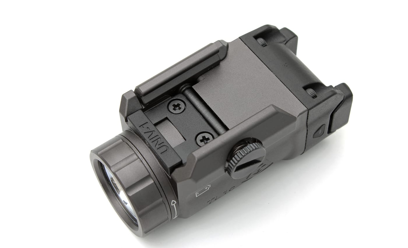 Close-up photo showing the underside and side details of the GRITR TL1c Compact Weapon Light, with a focus on the precision machining and dehorned slide rails. Even in areas that would typically be hidden from view once mounted on a handgun, the craftsmanship stands out, with smooth edges and no sharp corners. The image illustrates the care GRITR puts into quality control, supporting the article’s point about high standards in design and production. The finish is consistent and there are no visible machining marks or rough spots, adding to the premium feel of the product. This photo is useful for readers who want to know about real-world build quality, not just specs on paper.