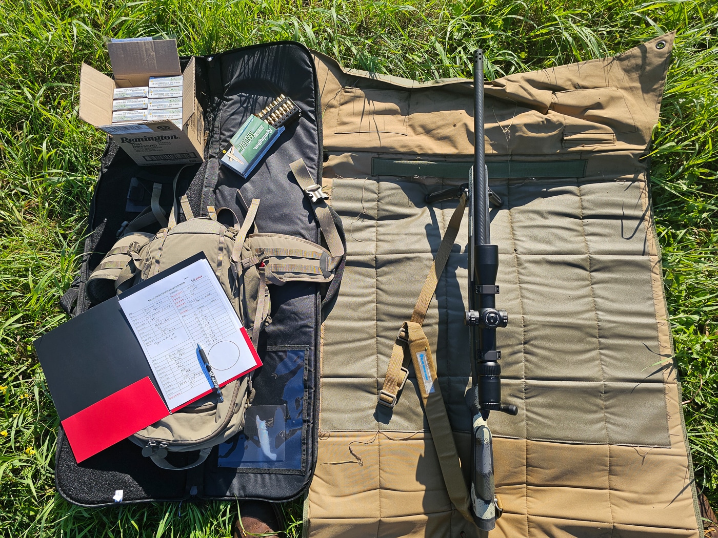 A close-up of the author’s complete hunting setup used in the Vortex Optics Hunter Marksmanship Course, featuring a Springfield Model 2020 Waypoint rifle chambered in 6.5 Creedmoor with a Vortex Strike Eagle 3–18x44mm FFP scope. The rifle rests with a Magpul M-LOK bipod and Blue Force Gear Vickers sling attached. Beside it are boxes of Remington Premier Match 140-grain ammunition and a hunting pack. The image highlights the functional, field-ready gear configuration used throughout the course. It showcases a practical mix of modern optics, reliable ammunition, and well-balanced components. This setup represents the importance of mastering personal equipment for ethical hunting and accurate marksmanship.