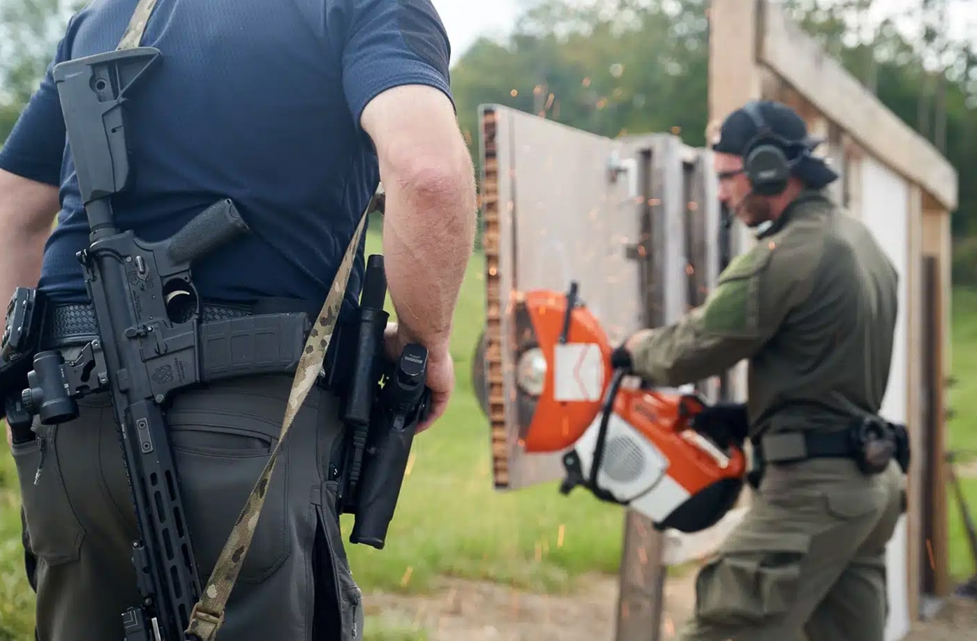 An instructor observes officers practicing transitions and reloads with SAINT Victor AR-15 SBRs during a range qualification course. The rifles feature compact barrels, adjustable stocks, and optics suited for patrol or tactical use. The training scenario emphasizes practical, scenario-based exercises common to police departments across the country. Officers are spread along a marked firing line, maintaining spacing and safety protocols while firing controlled bursts. Brownells’ law enforcement program helps make this level of equipment and training more attainable through verified discounts on rifles and accessories. The photo highlights professional development, teamwork, and the increasing role of rifles like the SAINT Victor in modern policing. The tone is realistic and instructional, fitting the theme of law enforcement preparedness supported by Brownells’ discount program. Police patrol rifles like this patrol rifle police AR-15 with a short barrel is an excellent Brownells trade discount.