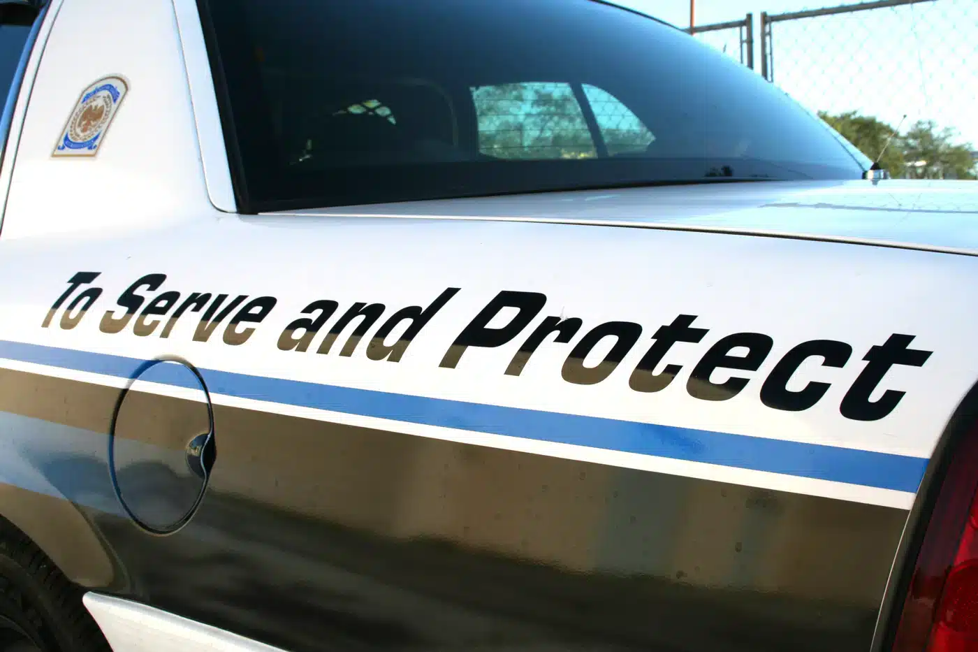 to serve and protect florida police car