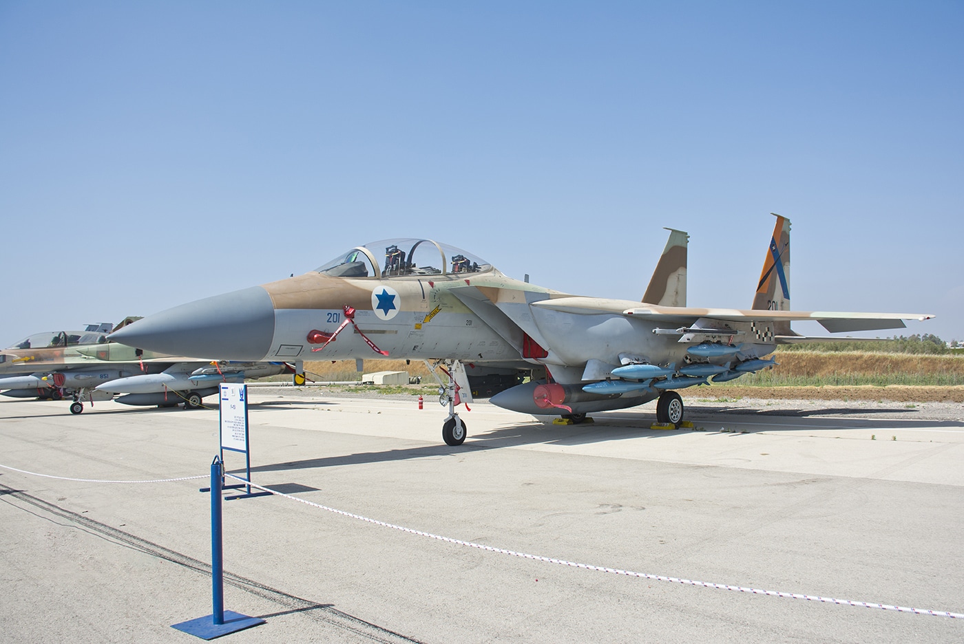 Israeli Air Force F-15I Ra'am Strike Eagle variant on static display during Israeli Independence Day celebrations in 2017 showing customized multirole fighter developed for Israel Defense Forces. The twin-engine tactical fighter features Hebrew "Thunder" designation and Israeli Air Force markings with blue Star of David on fuselage and vertical stabilizers. F-15I Ra'am entered service with IAF in January 1998 incorporating advanced systems including Elbit display and sight helmet DASH system, Elisra electronic warfare suite, and LANTIRN targeting pods. The Israeli Strike Eagle variant serves alongside earlier F-15A Baz and F-15B air superiority fighters demonstrating Eagle family versatility for air-to-air and air-to-ground combat operations. IAF F-15I aircraft have conducted combat missions against Hezbollah positions in Lebanon, Hamas targets in Gaza, Syrian military installations, and Iranian nuclear facilities. The Ra'am features McDonnell Douglas F-15E airframe with Israeli-specific modifications including customized avionics, weapons systems, and electronic warfare capabilities meeting Israel Defense Forces operational requirements. Israeli Air Force employs F-15I alongside fifth-generation F-35I Adir Lightning II fighters conducting precision strike operations protecting Israeli national security interests throughout Middle East region.
