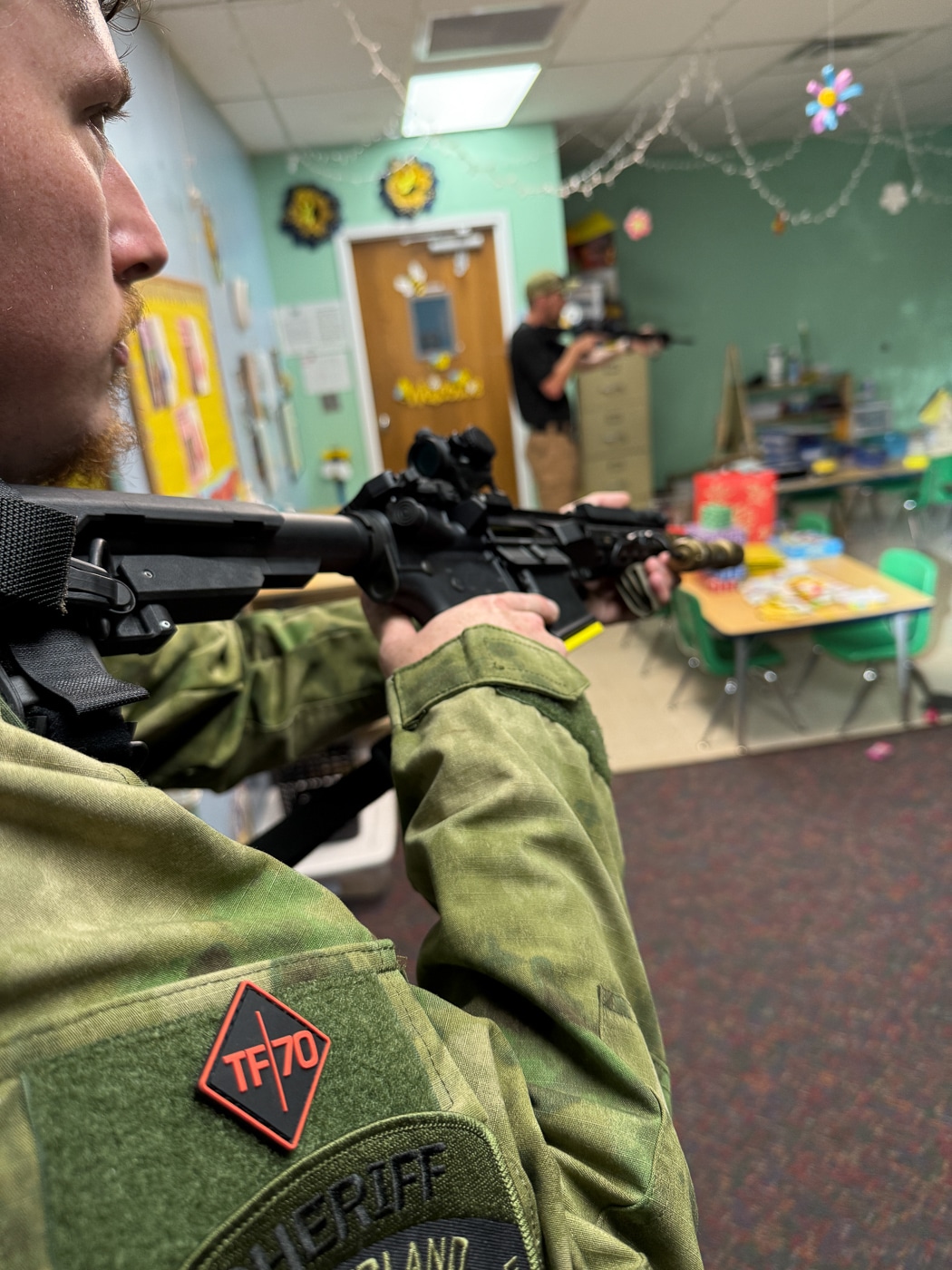 Law enforcement officers participating in Task Force 70 active shooter training learning immediate response tactics for violent emergency situations in schools, businesses, and public areas. TF70 instructors teach small department police rapid entry breaching methods, threat neutralization techniques, and victim medical stabilization skills needed when specialized units cannot arrive in time. Officers from rural agencies practice patrol tactical operations for active threat scenarios that require instant intervention rather than waiting for SWAT teams that may be hours away in small town jurisdictions serving communities under 10,000 people with limited backup resources.