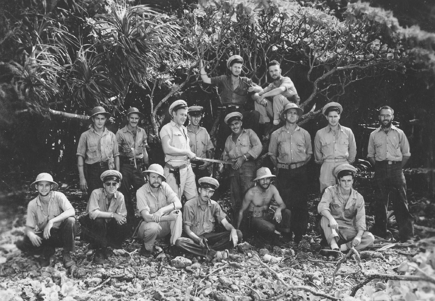 Group of United States Navy sailors rescued from USS Lexington CV-2 posing for photograph after being returned to Hawaii following the Battle of Coral Sea on May 8, 1942. Lady Lex survivors were evacuated from the burning carrier after Captain Frederick C. Sherman ordered abandon ship in late afternoon when uncontrollable fires made salvage impossible. USS Lexington aircraft carrier crew members descended lifelines into the warm Coral Sea waters before being rescued by USS Minneapolis CL-36 and escorting destroyers from Task Group 17.5. More than 300 Lexington CV-2 sailors were pulled from the water with every living soul aboard the carrier saved including Captain Sherman's dog. USS Lexington had been struck by two Type 91 torpedoes and multiple aerial bombs during Japanese attacks that morning causing catastrophic fires throughout the converted Lexington-class battlecruiser. Lady Lex survivors were transported back to Pearl Harbor after the Battle of Coral Sea though 216 crew members and aviators had been killed during the attacks. USS Lexington CV-2 became the first United States Navy fleet aircraft carrier lost in World War II after earning two battle stars during five months of Pacific combat operations.