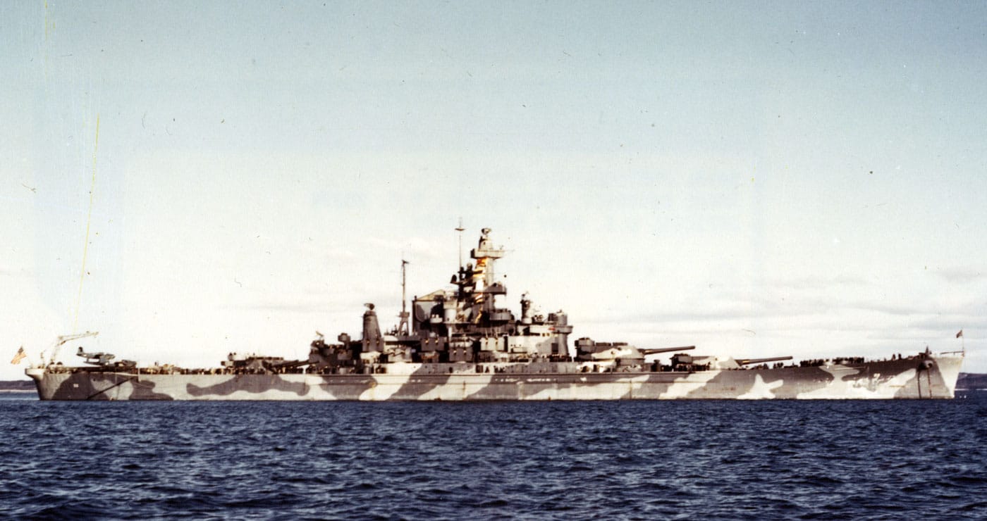 USS Alabama BB-60 American fast battleship in Casco Bay, Maine during her shakedown period circa December 1942, displaying Measure 12 modified camouflage scheme and representing one of four South Dakota-class vessels that were similar to but improved over the North Carolina-class fast battleships. The South Dakota-class United States fast battleships consisted of USS South Dakota BB-57, USS Indiana BB-58, USS Massachusetts BB-59, and USS Alabama BB-60, all entering service after the Pearl Harbor attack and featuring more compact turrets with thickened armor on both decks and belt compared to the North Carolina-class. While very similar to the North Carolina-class fast battleships in armament with nine 16-inch guns in three turrets and capable of similar speeds around 27-28 knots, the South Dakota-class vessels were visually distinguishable as they had a single stack while the prior North Carolina-class had two funnels. All four South Dakota-class fast battleships were critical to United States Navy combat operations during World War II, with these vessels earning between 9 and 13 battle stars apiece through extensive Pacific Theater operations including fleet actions, amphibious support, and carrier escort duties. USS South Dakota BB-57 and USS Indiana BB-58 were sold for scrap in the 1960s during post-war naval reductions, but both USS Massachusetts BB-59 and USS Alabama BB-60 serve as museum ships today preserving these historic fast battleships. The photograph shows USS Alabama in her wartime camouflage scheme during shakedown training, demonstrating the preparations fast battleships underwent before deploying to combat operations in the Pacific and Atlantic theaters. The South Dakota-class represented continued evolution of American fast battleship design, incorporating lessons from the North Carolina-class while maintaining the high speeds necessary to operate with fast carrier task forces that dominated naval warfare. As treaty breakout designs no longer constrained by pre-war international agreements, the South Dakota-class fast battleships demonstrated improved protection schemes while maintaining the firepower and speed that made American fast battleships the most capable capital ships of World War II.