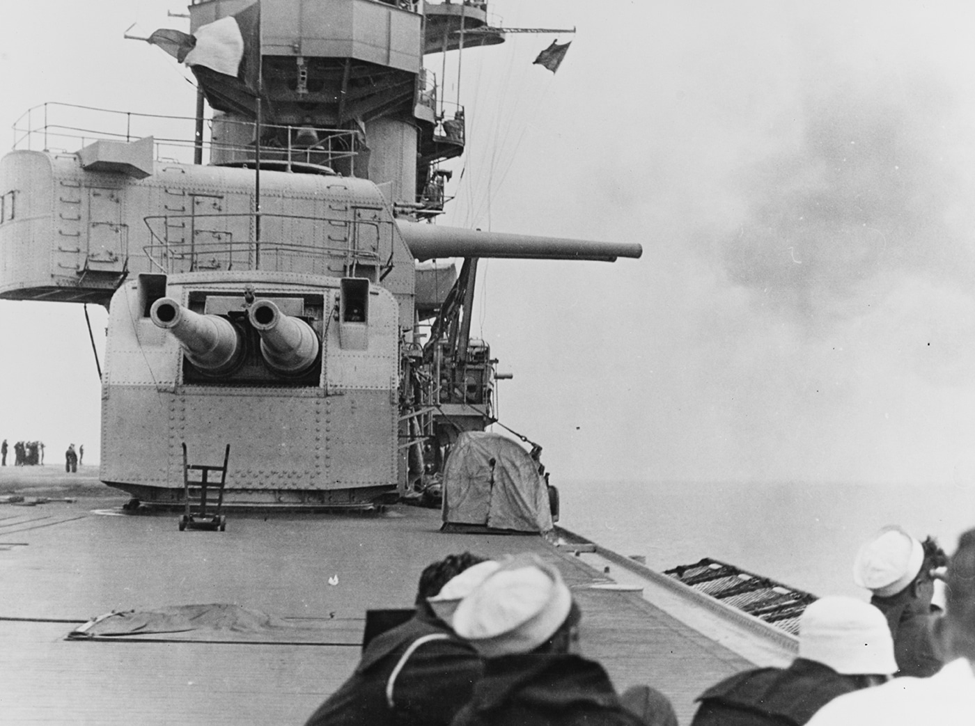 Dual-mount 8-inch gun turret installed aboard USS Lexington CV-2, showing the heavy armament carried by the converted Lexington-class battlecruiser carrier during World War II service. Lady Lex was equipped with eight 8-inch guns in four dual turrets along with a dozen 5-inch anti-aircraft guns when commissioned in late 1927. The Lexington aircraft carrier featured these battleship-caliber weapons because naval aviation was still considered experimental during the 1920s when the converted battlecruisers were completed. USS Lexington CV-2 retained the 8-inch gun armament throughout her service despite carrier doctrine evolving to rely primarily on aircraft for offense and defense. This dual turret mount represented transitional thinking when the United States Navy was uncertain whether carriers could operate effectively without heavy surface combat weapons. The Lexington-class carriers CV-2 and CV-3 Saratoga both carried these 8-inch guns on their converted battlecruiser hulls displacing 36,000 tons. USS Lexington operated under the Washington Naval Treaty provisions allowing battlecruiser conversions to aircraft carriers with added displacement for protection. Lady Lex earned two battle stars during five months of Pacific combat before being lost at the Battle of Coral Sea in May 1942.