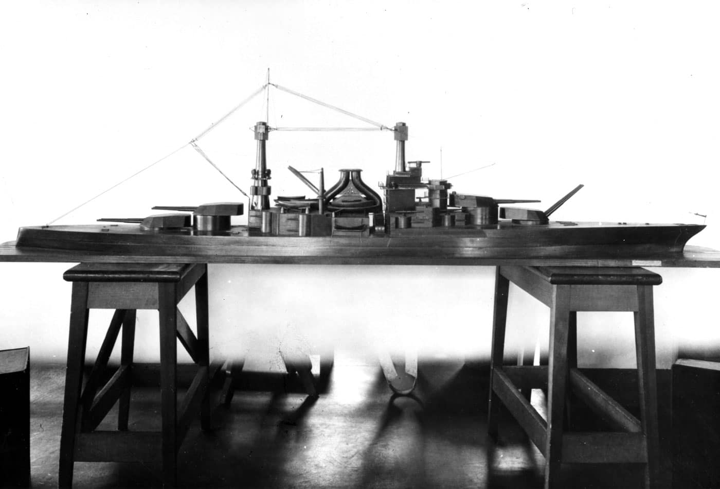 Model of USS South Dakota BB-49 American battleship used during the design phase, representing one of six South Dakota-class vessels that were intended to be bigger and more powerful than any United States battleships built before them but were never completed due to Washington Naval Treaty restrictions. The South Dakota-class United States battleships were to have been USS South Dakota BB-49, USS Indiana BB-50, USS Montana BB-51, USS North Carolina BB-52, USS Iowa BB-53, and USS Massachusetts BB-54, all laid down but none completed beyond approximately 39% construction. This class of battleships was intended to represent a significant leap forward in American battleship design, incorporating lessons learned from World War I naval combat and featuring enhanced armament, armor protection, and propulsion systems superior to earlier standard-type battleships. The Washington Naval Treaty put these ambitious South Dakota-class battleships on the chopping block, as the 1922 treaty imposed strict limitations on battleship tonnage and numbers that forced the United States Navy to cancel numerous capital ship construction projects. All six South Dakota-class battleships were scrapped in 1923 despite substantial resources already invested in their construction, victims of international treaty restrictions that fundamentally reshaped American battleship development for nearly two decades. The design model shows the intended configuration of these advanced battleships that would have represented the next generation of United States Navy capital ships beyond the Colorado-class super-dreadnoughts. The cancellation of the South Dakota-class BB-49 vessels created a nearly two-decade gap in American battleship construction until treaty limitations expired and the United States could design modern battleships like the North Carolina-class that eventually commissioned in the late 1930s. Interestingly, the name South Dakota would be reused for a later class of fast battleships including USS South Dakota BB-57 that commissioned during World War II, as would several other names from this canceled class including Indiana, Montana, North Carolina, Iowa, and Massachusetts.