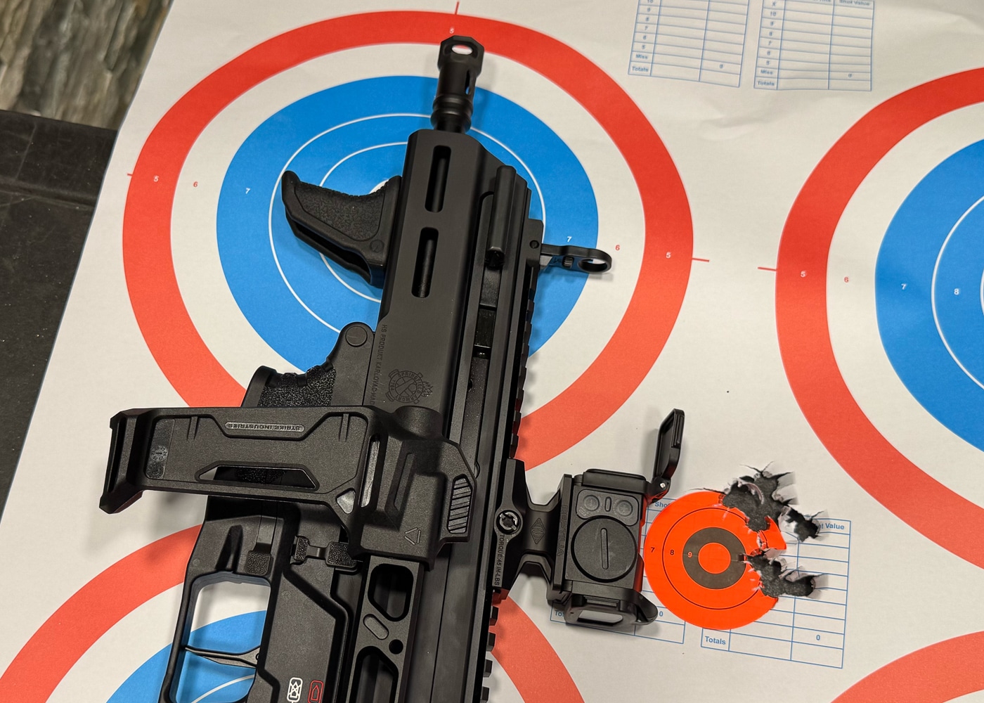 Target showing tight shot grouping from Springfield Armory Kuna truck gun demonstrating exceptional accuracy and precision for defensive pistol applications. Kuna 9mm pistol accuracy results illustrating flat-shooting characteristics and roller-delayed operating system performance benefits. Springfield Armory truck gun target practice showing consistent shot placement and reliable defensive firearm capabilities. Vehicle gun accuracy demonstration with Kuna pistol featuring multi-port muzzle brake for recoil reduction and improved precision. Defensive shooting results from Springfield Armory Kuna showcasing compact pistol accuracy rivaling larger firearms for personal protection scenarios. Truck gun precision testing with Kuna demonstrating effective defensive capability and shooter confidence through consistent groupings. Springfield Armory Kuna accuracy performance highlighting quality barrel and operating system contributing to excellent shot placement. Target results from vehicle defense firearm showing Kuna pistol delivers precision necessary for serious self-defense applications.