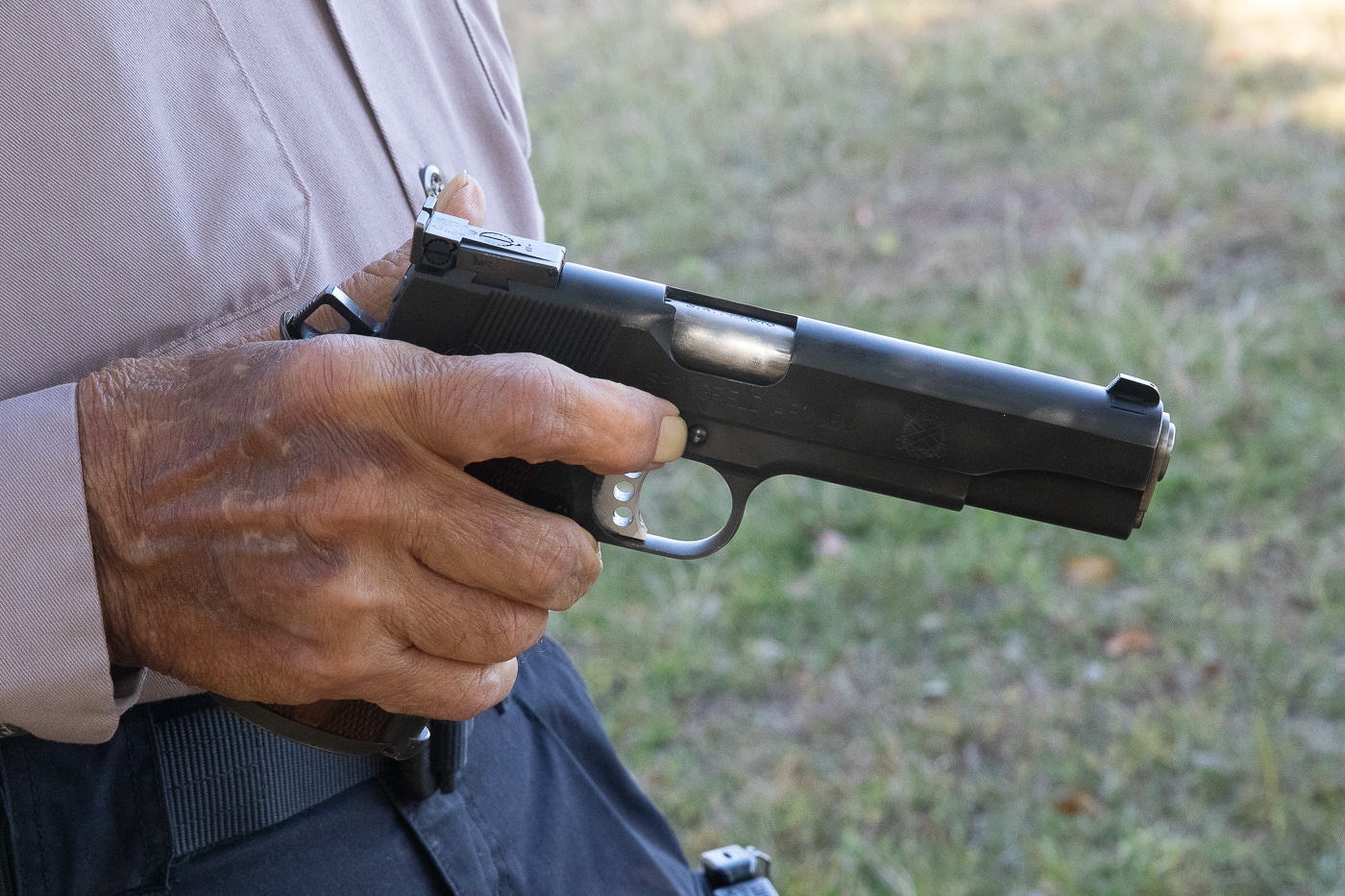author demonstrates how to keep finger out of trigger guard