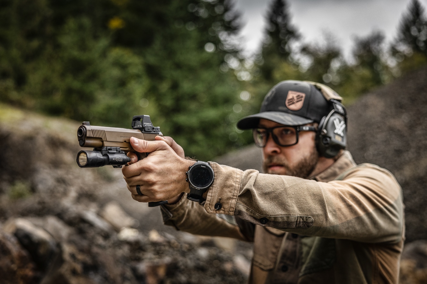 author shooting Springfield 1911 with Vortex red dot sight