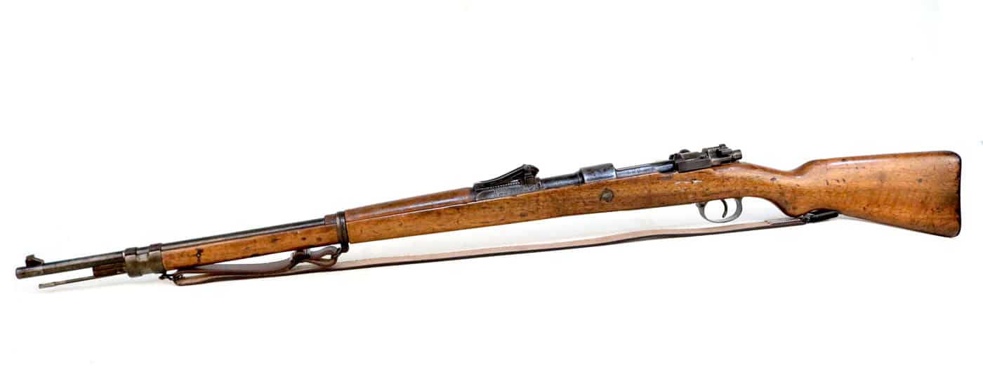 The Gewehr 98 bolt-action rifle served as the standard issue infantry weapon for Imperial German Army forces throughout World War I from 1914 to 1918. This German military rifle chambered in 7.92x57mm Mauser S Patrone cartridge equipped millions of soldiers fighting in trenches across the Western Front, Eastern Front, and other theaters of the Great War. The Gew 98 rifle with its 29-inch barrel and controlled-feed Mauser action provided German infantrymen with reliable firepower during brutal trench combat at locations like Ypres, Verdun, Somme, and Fromelles. The five-round internal magazine loaded via stripper clips allowed German soldiers to maintain sustained fire while the rifle's robust construction withstood mud, water, and harsh battlefield conditions. Over nine million G98 rifles were manufactured between 1898 and 1918 making the Gewehr 98 one of the most widely produced military bolt-action rifles of World War I era.