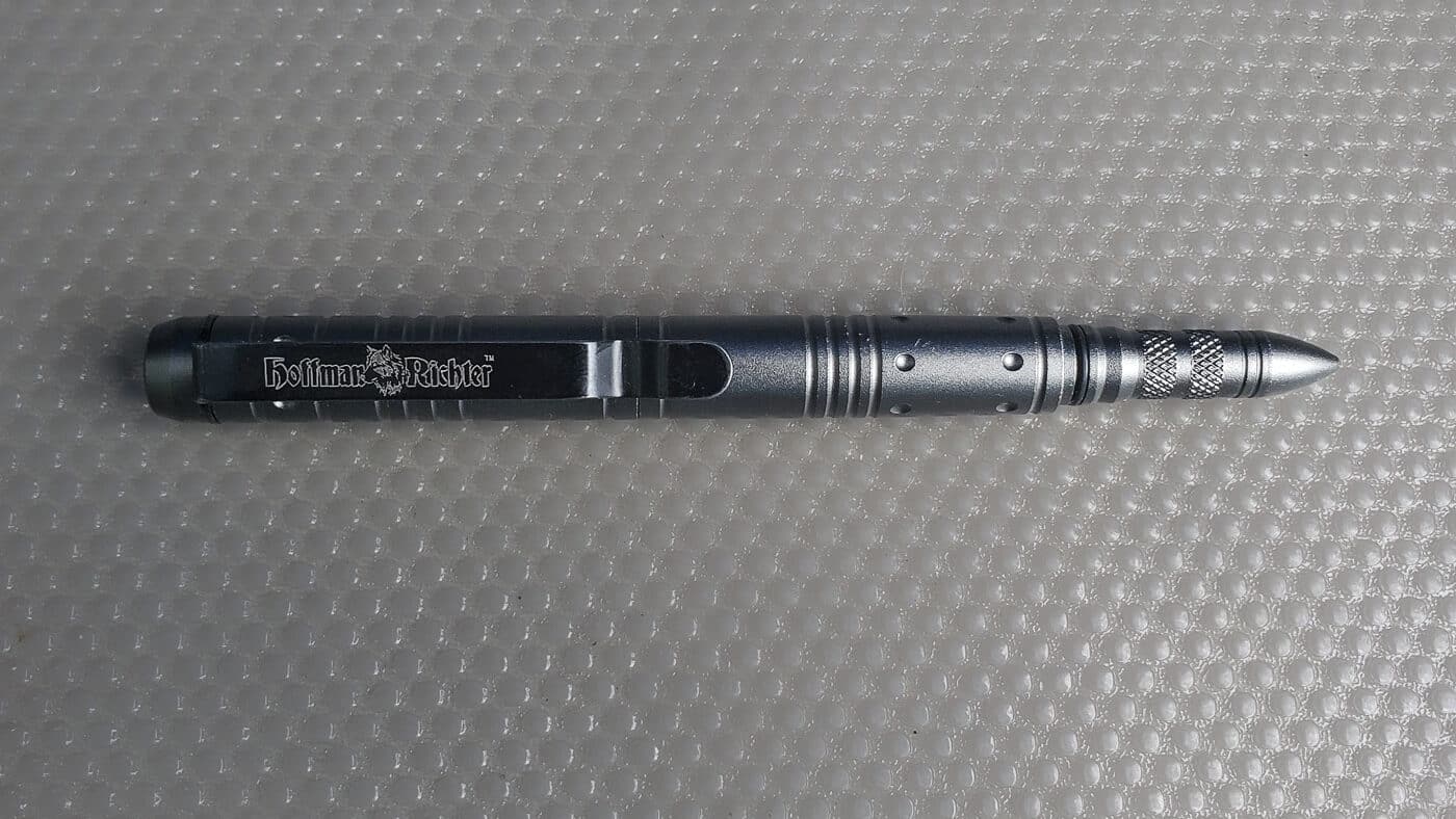 Author's tactical pen shown as part of an everyday carry self-protection setup, serving dual purposes as a functional writing instrument and a defensive tool for emergency situations. The reinforced construction features a hardened tip designed for striking if needed during a close-quarters threat response when other personal protection options are unavailable. This EDC item fits easily in a pocket, bag, or clipped to clothing, making it one of the most accessible and inconspicuous pieces of self-defense gear you can carry daily. The tactical pen works well for taking notes, jotting down important information, or documenting details after an incident, while its sturdy build means it won't fail when used under stress. Many security-conscious individuals include a quality tactical pen in their everyday carry loadout as a backup defensive option alongside knives, pepper spray, and firearms.