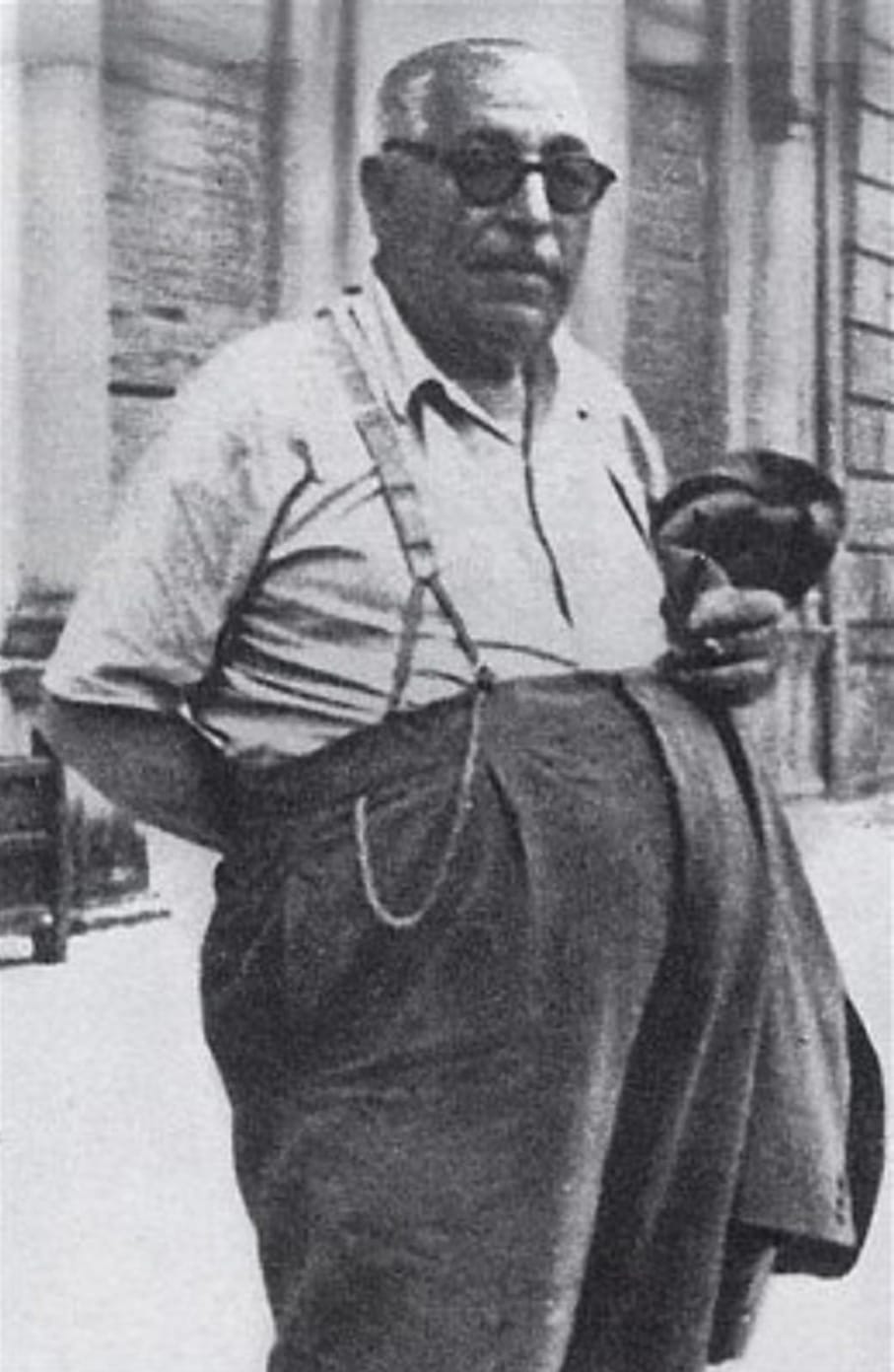 An older Sicilian man with a stern expression poses for a photograph, representing the powerful Mafia figure who controlled Villalba and assisted Allied forces. Operation Underworld extended beyond American shores to Sicily during invasion operations. Mafia role in World War II included providing local intelligence to Allied troops. Calogero Vizzini wielded dominant influence throughout Villalba and surrounding regions. Criminal networks helped soldiers navigate unfamiliar rugged terrain safely. Luciano facilitated contact between American military planners and Sicilian mobsters. Local Mafia leaders identified fascist loyalists and German troop movements. The collaboration persuaded villagers to cooperate with foreign invading forces. Vizzini's participation filled power vacuums left by collapsing fascist rule.