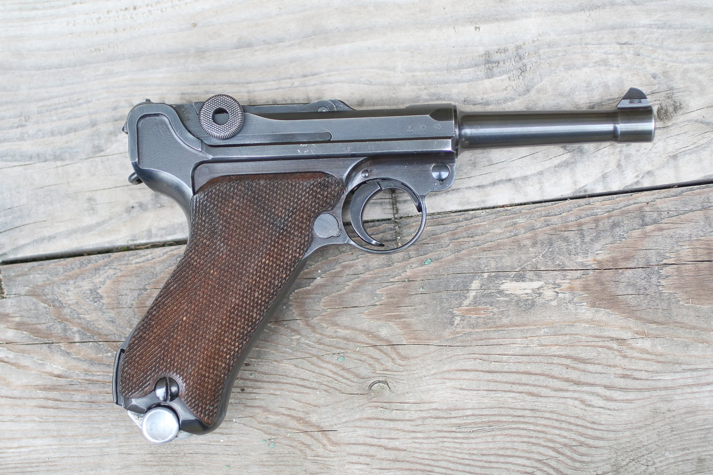 A German Luger P08 pistol is displayed showing its distinctive toggle-lock action and iconic profile that made it the most desired handgun among Allied soldiers. War trophy value varied by weapon type. Luger pistols commanded highest desirability. Enemy sidearms held different appeal levels. Trophy firearms reflected rarity and prestige. Military souvenirs had hierarchical worth. War keepsakes ranged from common to exceptional. Captured Lugers represented ultimate prizes. Trophy weapons embodied soldier aspirations fully.