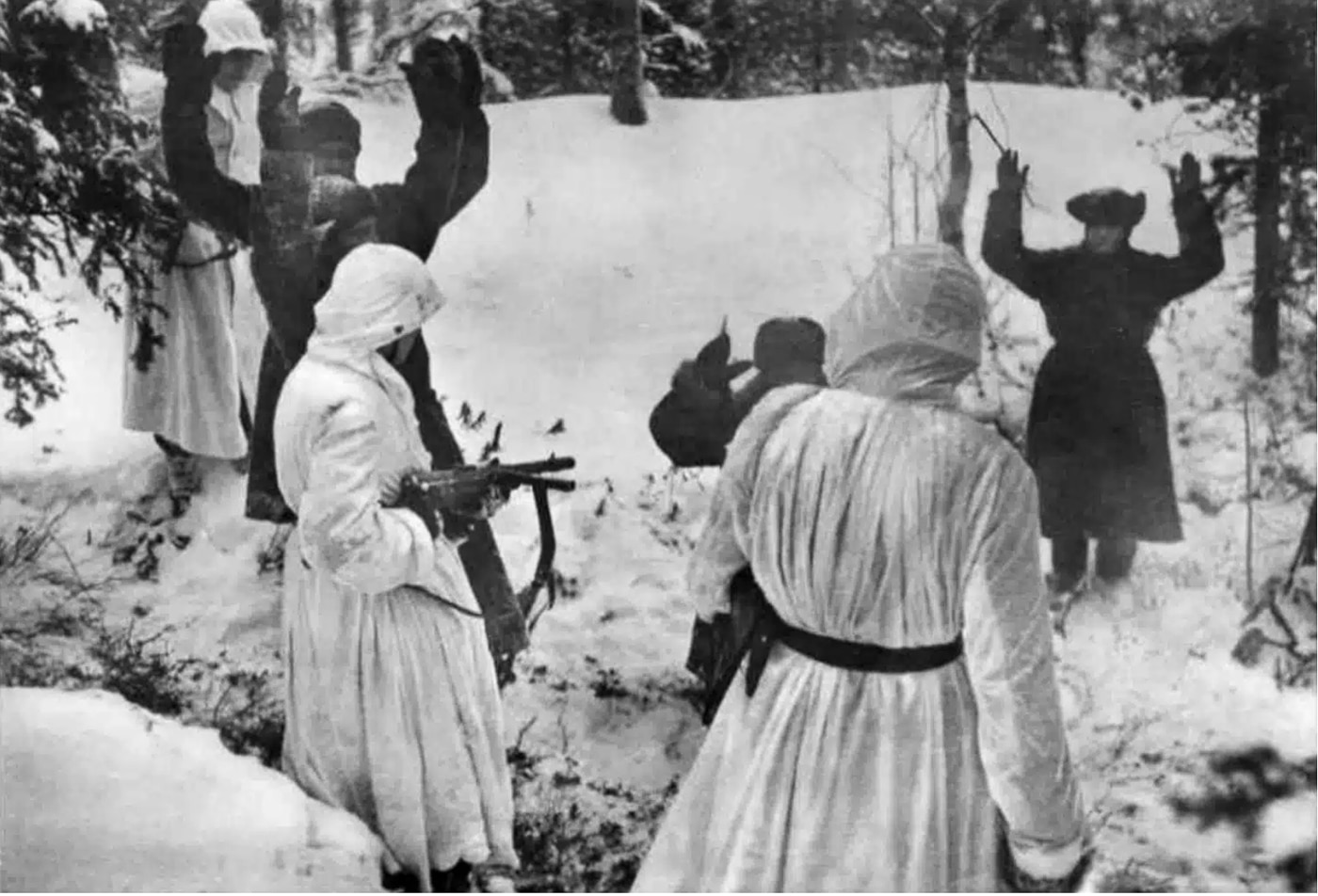 German soldiers carrying Bergmann MP35 submachine guns during Eastern Front operations, with captured enemy personnel visible in the scene, illustrating the weapon's combat deployment. MP35 firearms equipped SS combat units. Bergmann submachine guns saw extensive frontline service. The MP35 submachine gun participated in Eastern campaigns. German forces employed MP35 weapons operationally. SS troops used MP35 firearms in battle. The Bergmann MP35 served throughout WWII. Waffen SS soldiers carried these submachine guns. This weapon witnessed major Eastern Front engagements.