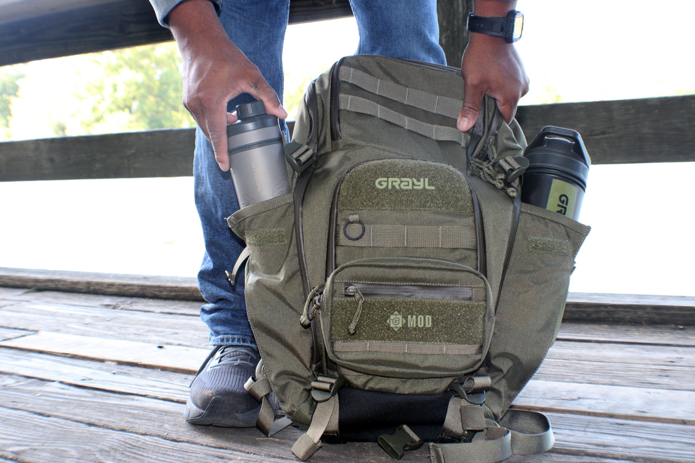 A Grayl-branded outdoor backpack in neutral tones features reinforced straps, multiple compartments, and weather-resistant materials designed for rugged wilderness environments and extended trail use. Backwoods carry kits utilize quality packs. Outdoors survival kits require reliable storage. Daypack systems organize hiking essentials. Wilderness bags support long treks. Trail equipment needs durable construction. Backcountry packs distribute weight effectively. Hiking containers protect supplies. Outdoor gear demands proper transport.