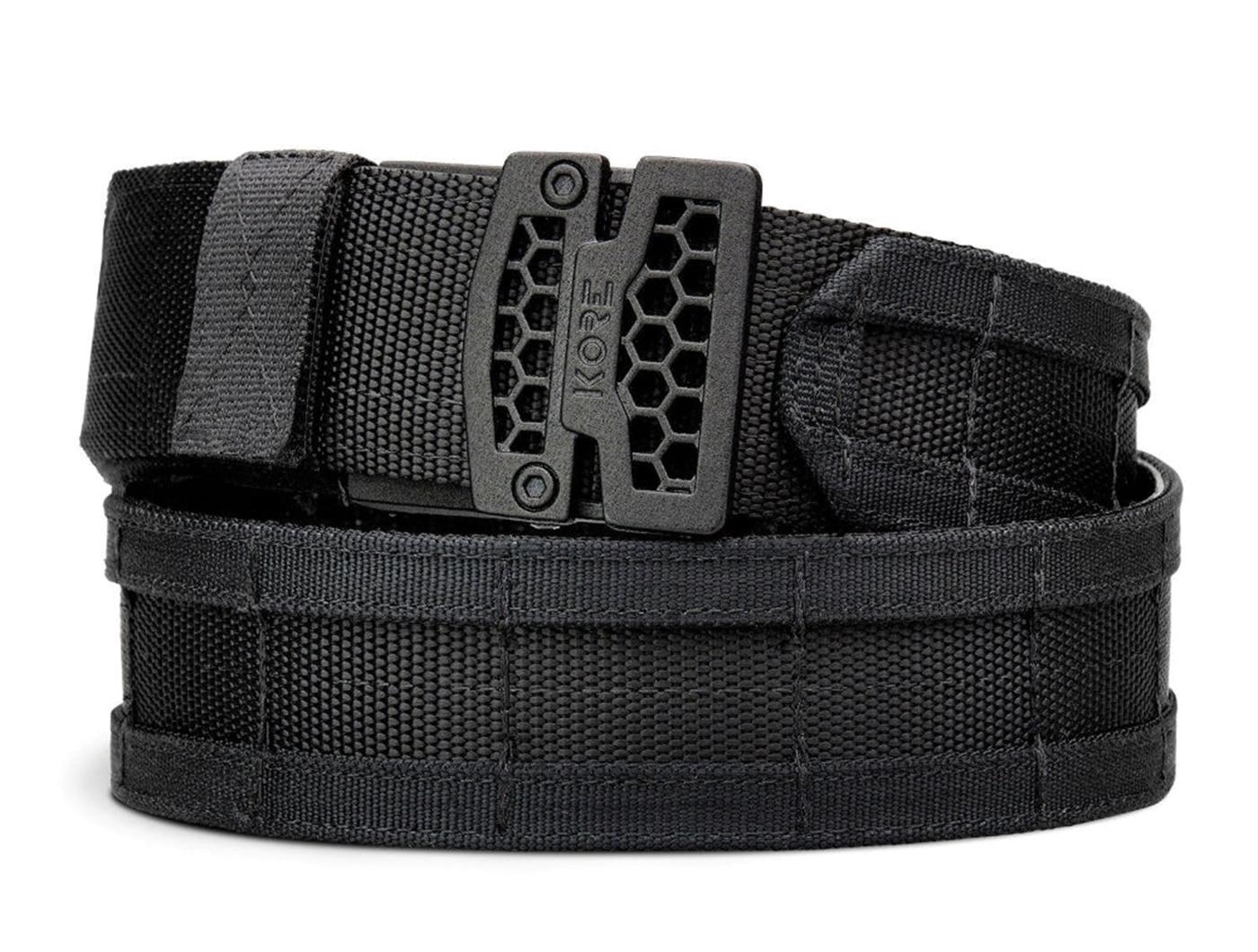 A KORE Essentials ratcheting tactical belt in dark color displays reinforced nylon construction, low-profile buckle mechanism, and micro-adjustment system designed for supporting firearms and equipment during outdoor activities. Backwoods carry kits require sturdy belts. Outdoors survival kits utilize retention systems. Gun belts support heavy loads. Wilderness carry demands rigid support. Trail belts distribute weight effectively. Backcountry equipment needs secure attachment. Hiking belts prevent sagging. Outdoor gear benefits from adjustability.