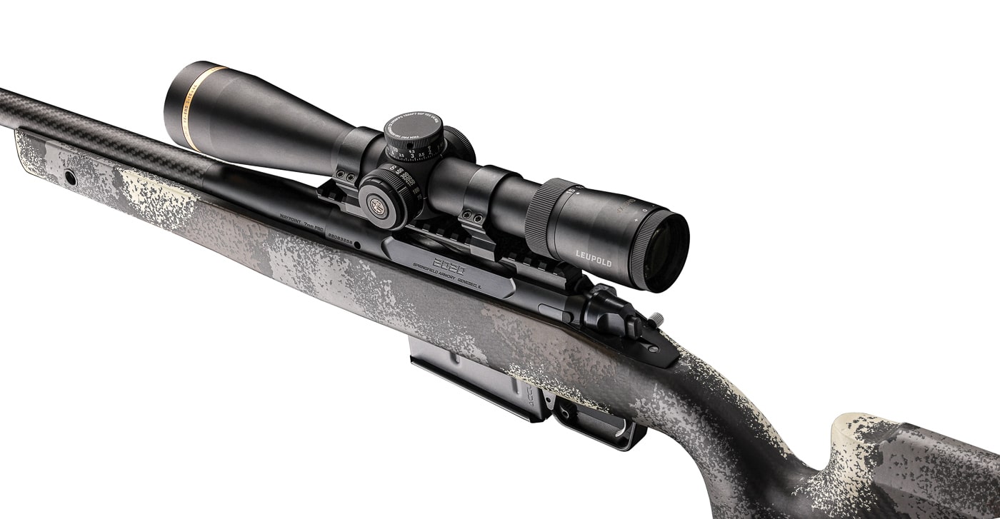 A detailed view of the Springfield Model 2020 Waypoint demonstrating its field-ready configuration for varied North American hunting applications. The 7mm PRC cartridge remains viable from 50 to 500 yards. Model 2020 Waypoints feature weatherproof Cerakote finish protection. Elk and moose hunting demands robust rifle construction. Springfield Armory designs rifles for serious backcountry pursuits. The Waypoint's carbon fiber stock resists environmental damage. Powerful cartridges enable ethical harvests at extended distances. The 7mm PRC Model 2020 Waypoint handles grizzly encounters confidently. Versatile hunting rifles eliminate the need for multiple firearms.