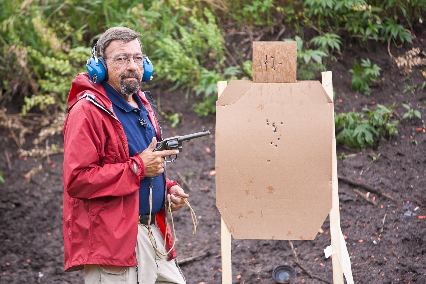 Massad Ayoob fires a vintage M1917 revolver at an outdoor shooting range, demonstrating a World War I era service weapon still in working condition today. War trophy firearms remain operational across generations. Military sidearms become functional heirlooms. Veterans' weapons preserve combat history tangibly. Bring-back pistols connect families to service members. Trophy revolvers survived decades after conflicts ended. Inherited military firearms maintain shooting capability. War souvenirs provide hands-on historical connections.