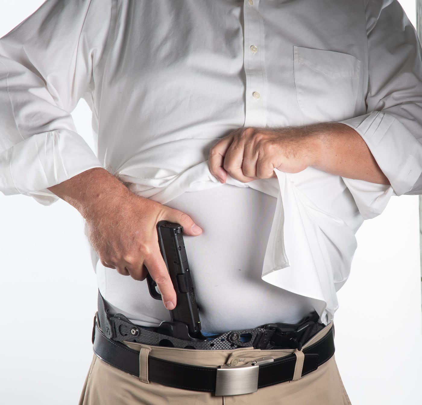 A PHLster Enigma holster system displays its integrated belt design and Kydex construction designed for concealing larger handguns beneath professional attire. Concealed carry at work benefits from modern holsters. Workplace CCW requires proper retention systems. Office carry demands integral belt technology. CCW at the office uses advanced holster designs. Professional concealment needs independent belt systems. Business attire accommodates Enigma holsters. Concealed carry at work eliminates traditional clips. Office defense includes revolutionary carry systems.