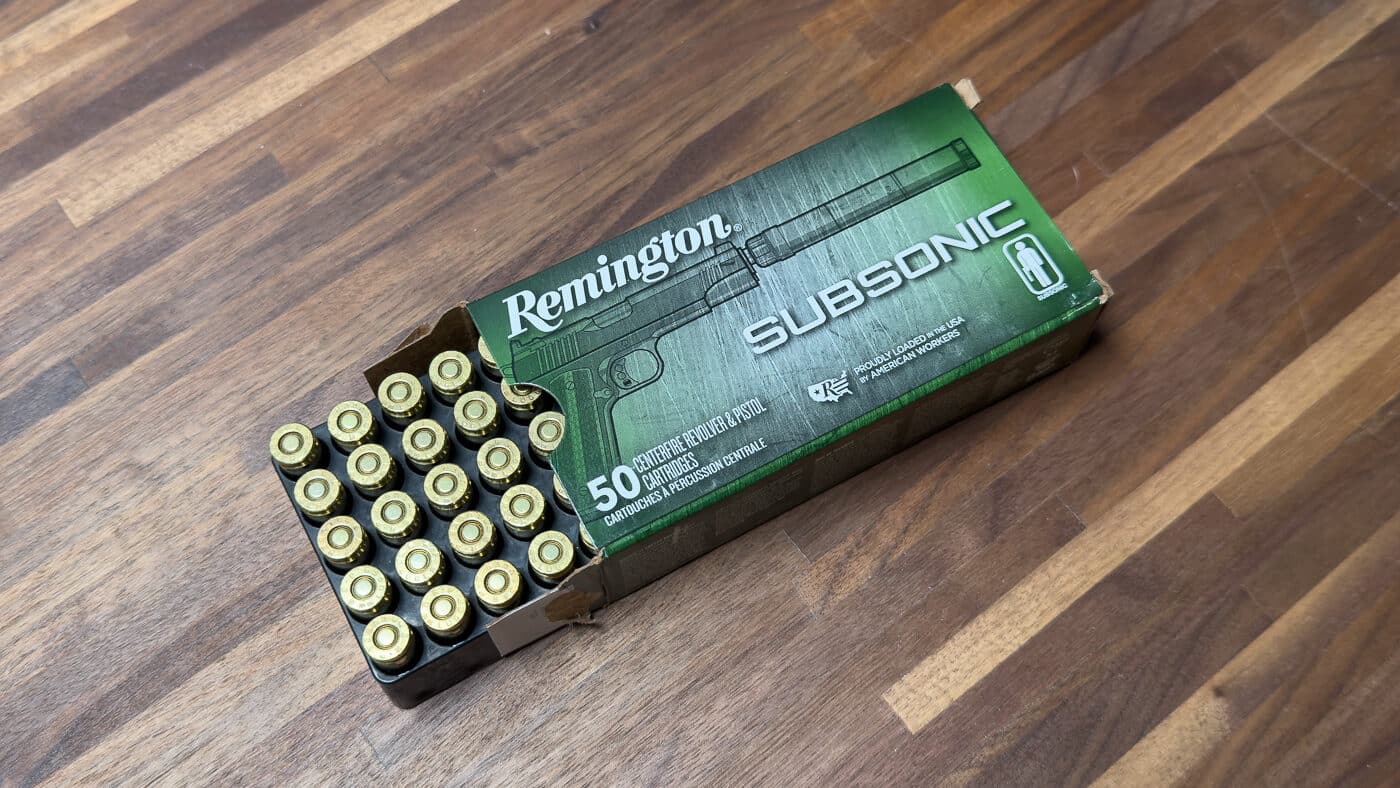A photograph of Remington 147-grain Subsonic 9mm ammunition used during the JK Armament 155 RPX suppressor evaluation for sound reduction testing purposes. The JK Armament suppressor review found Remington Subsonic performed exceptionally. Subsonic ammunition eliminates the supersonic crack completely. Heavier 147-grain bullets stay below sound barrier velocity. This load produced the quietest readings during testing. Sound suppressors work best with subsonic rounds typically. Shooters seeking maximum suppression should choose appropriate ammunition. The RPX silencer paired smoothly with this Remington load. Quiet suppressed shooting requires proper ammunition selection.
